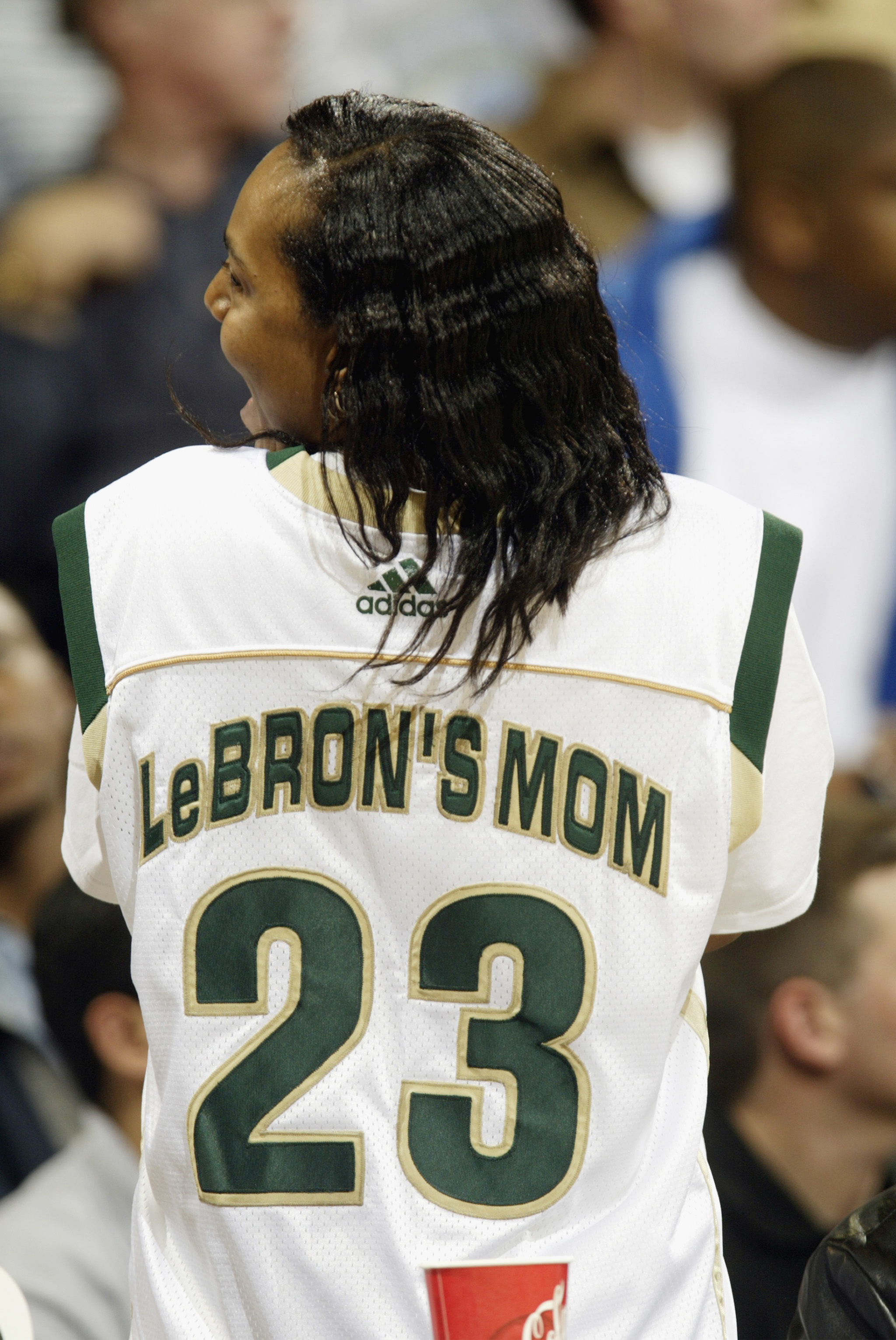 Gloria James, mother of LeBron James #23 of St. Vincent-St. Mary's High School, shows off her own team jersey at UCLA's Pauley Pavilion on January 4, 2003, in Los Angeles, California | Source: Getty Images