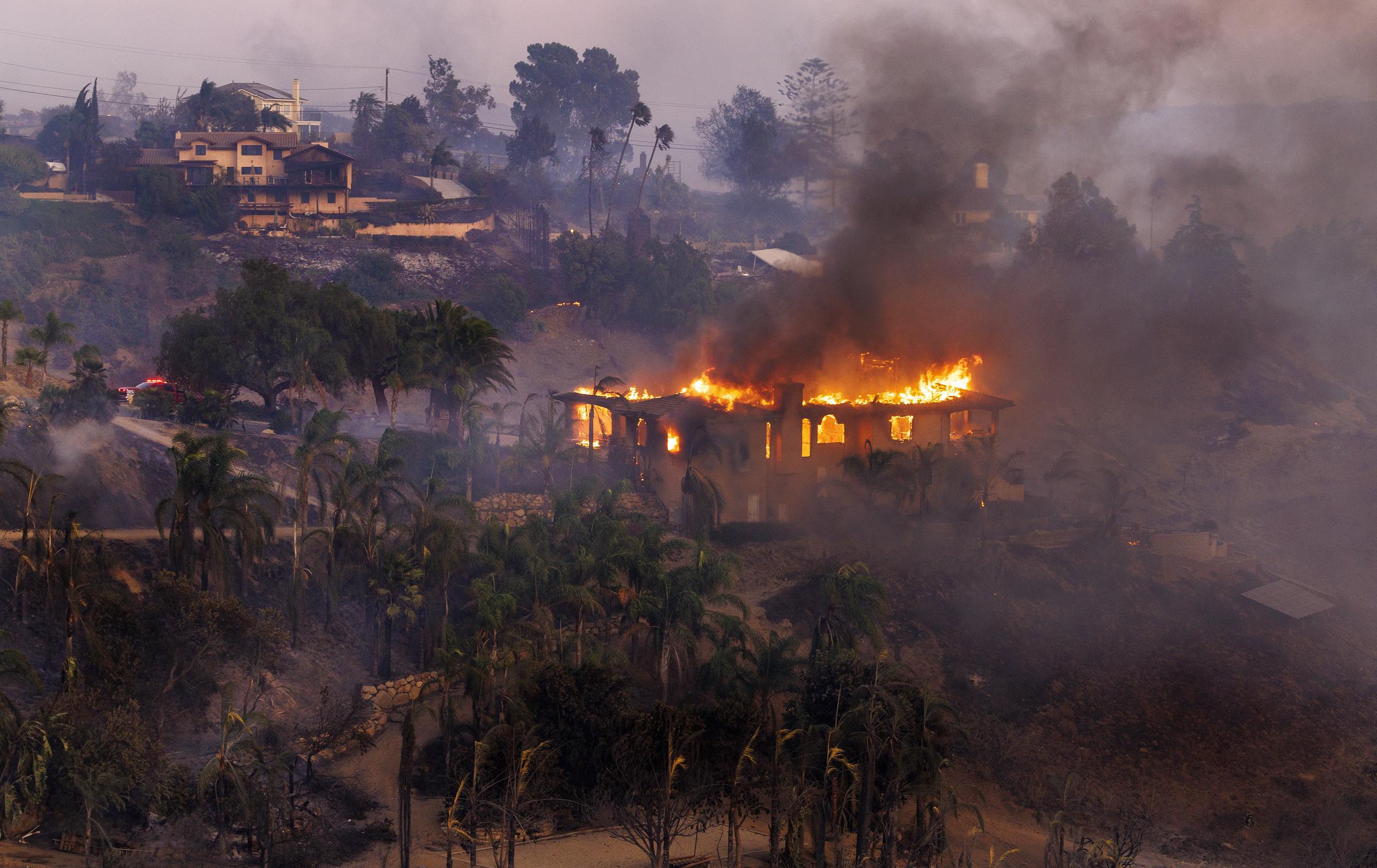 The Mountain Fire destroying a house and surrounding landscapes. | Source: Getty Images