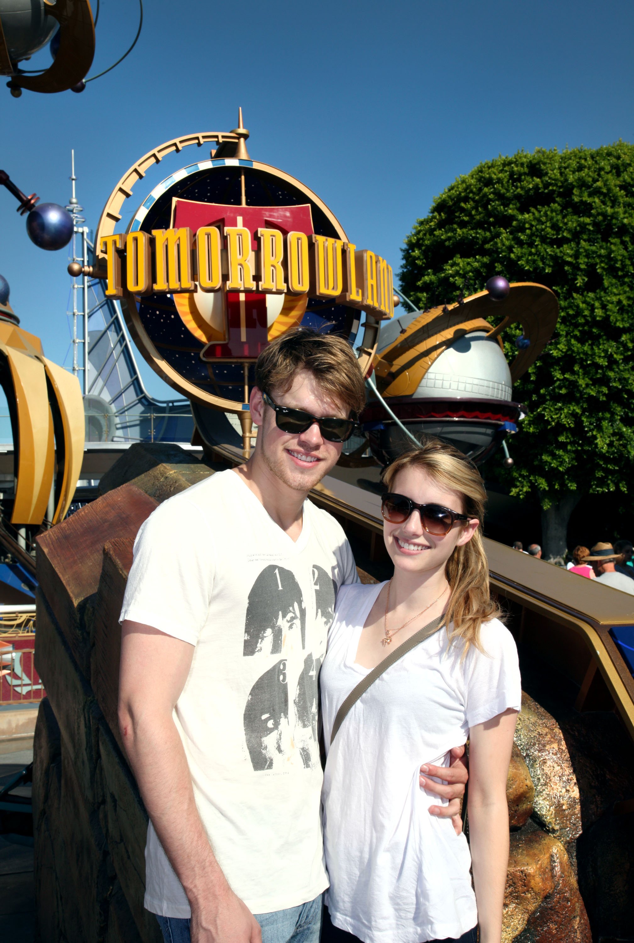 Chord Overstreet and Emma Roberts pose in front of the entrance to Tomorrowland at Disneyland on August 15, 2010, in Anaheim, California. | Source: Getty Images