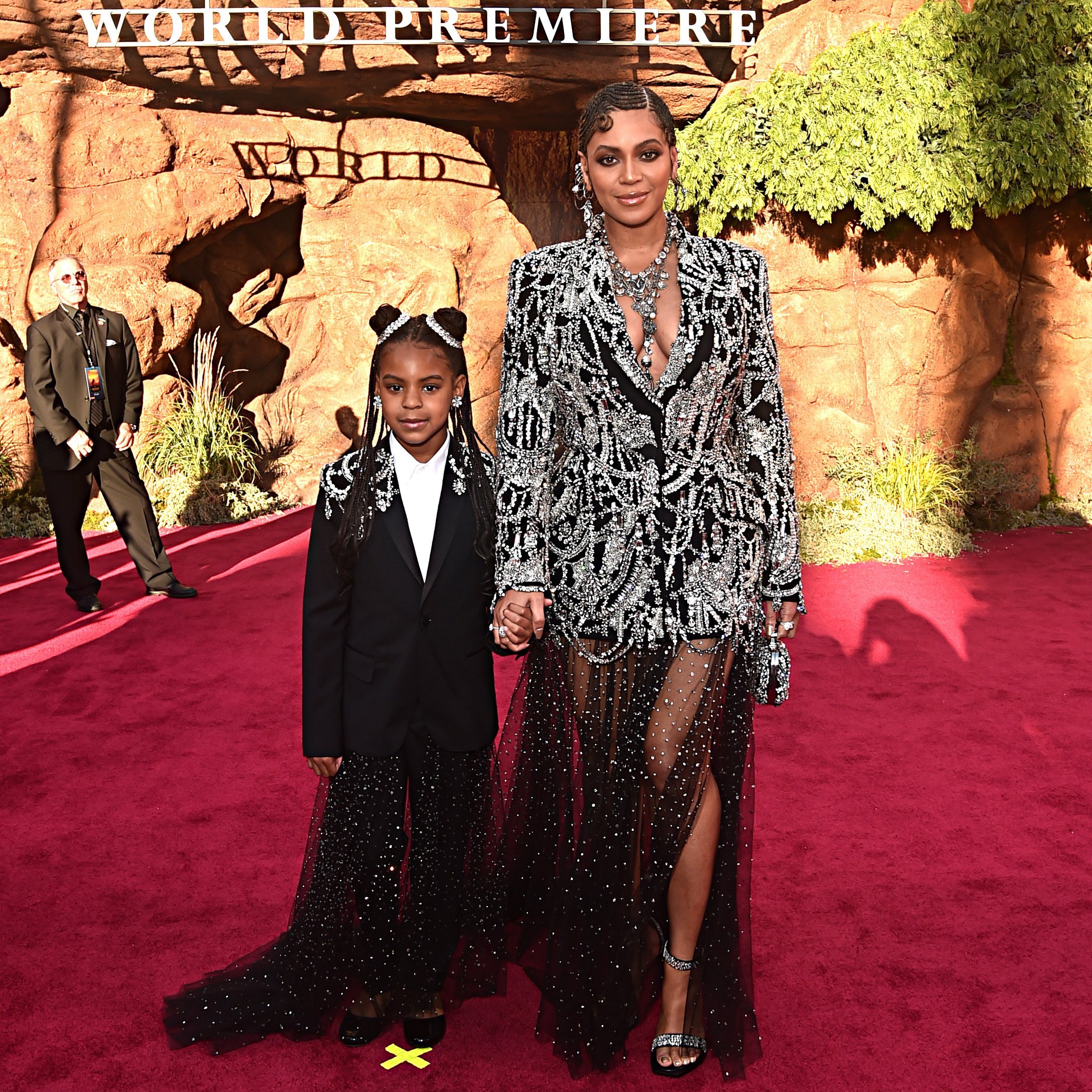 Beyonce is escorted by her daughter, Blue Ivy Carter at the world premiere of "The Lion King" at the Dolby Theater in Hollywood on July 9, 2019. | Source: Getty Images