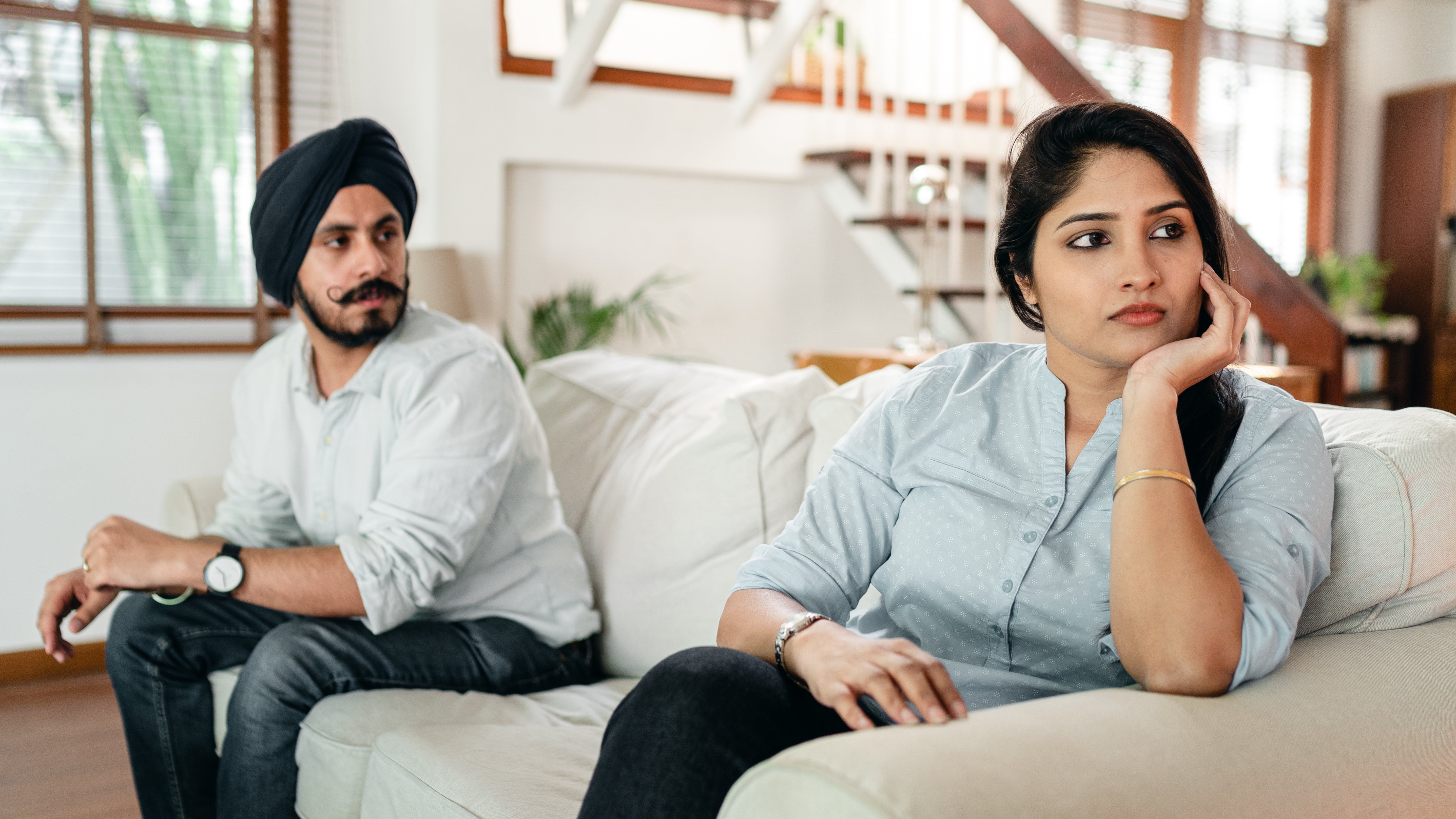 A man a a woman sitting on a couch | Source: Pexels