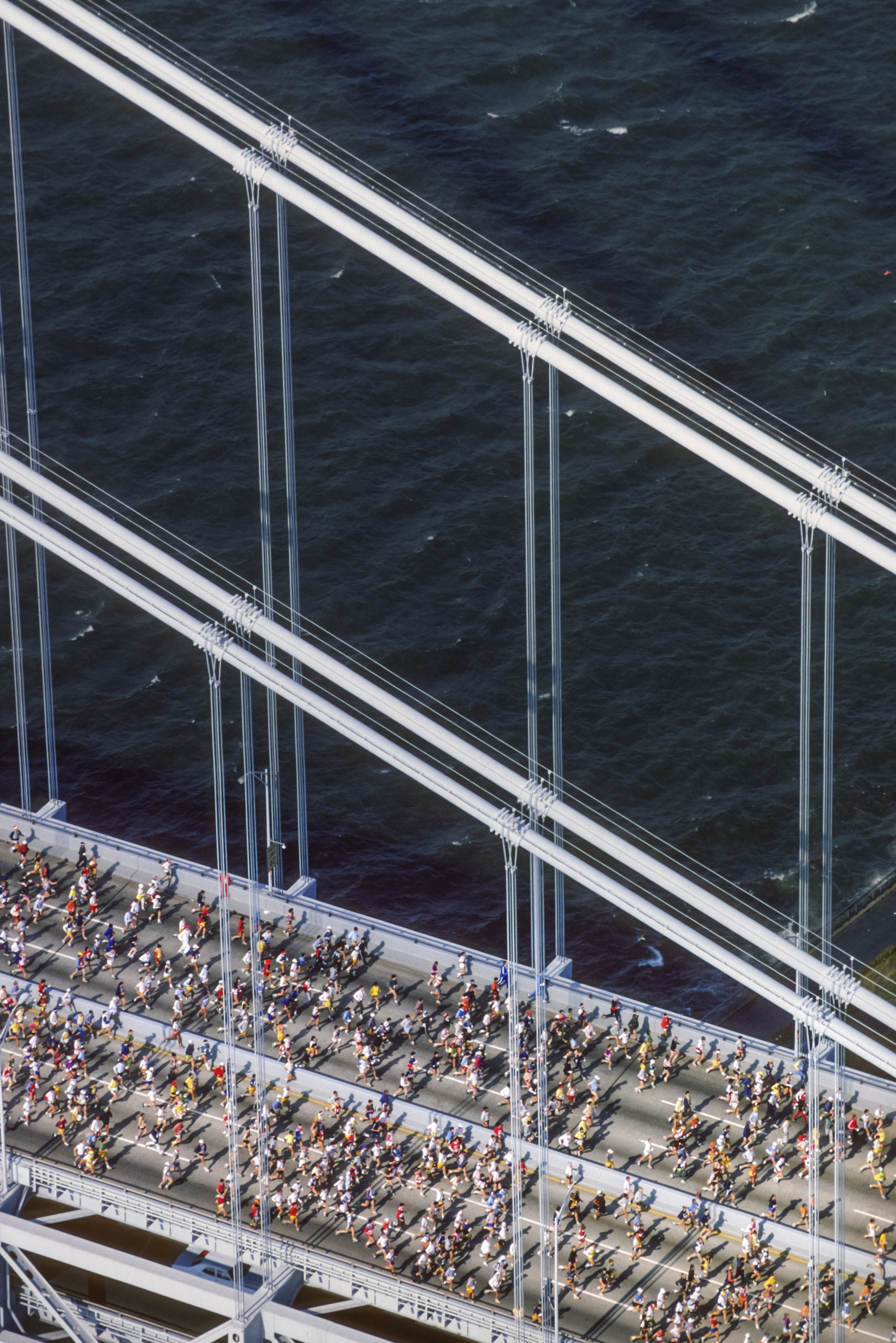 Runners competing in the New York City Marathon cross the Verrazzano Bridge from Staten Island at the beginning of the race on October 26, 1980. | Source: Getty Images