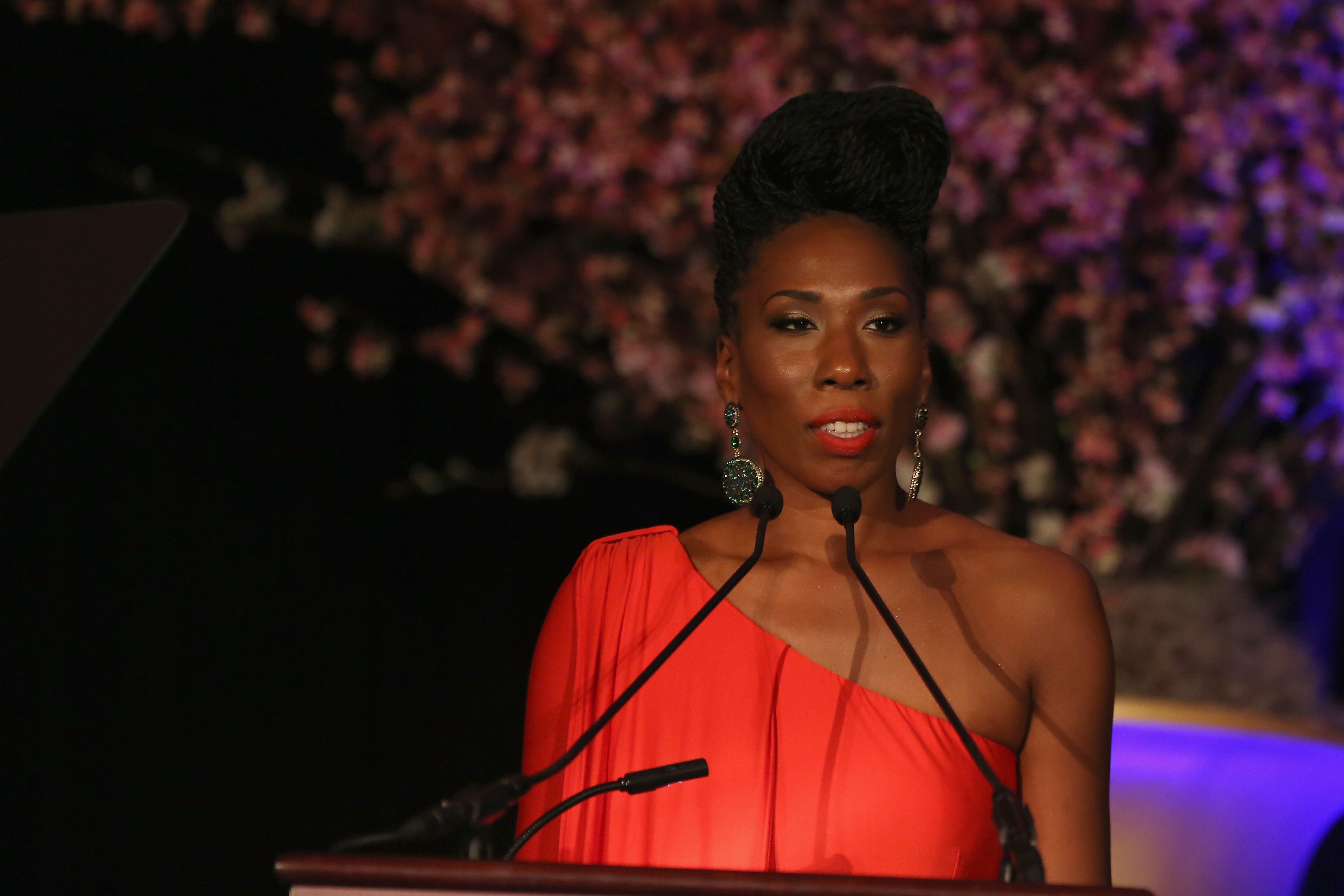 Brandi Harvey stands behind a podium during her speech at the "Steve & Marjorie Harvey Foundation Gala" on May 3, 2014, in Chicago, Illinois | Source: Getty Images