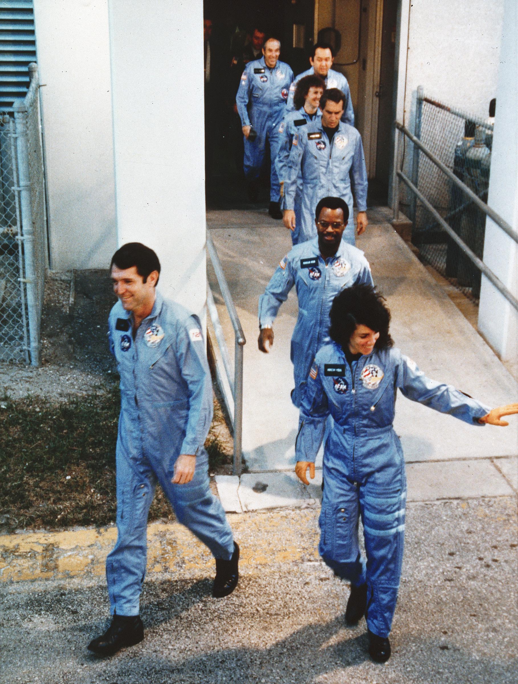 The crew of the Space Shuttle Challenger walk out of the Operations Building at Kennedy Space Center in Florida on their way to launch Pad-39B. The seven lost their lives when the Challenger exploded shortly after liftoff, on January 28, 1986 | Source: Getty Images