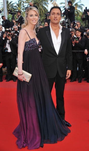  Dany Brillant avec Nathalie Moury assistent au "Wall Street" au Palais des Festivals pendant le 63ème Festival de Cannes à Cannes, France. | Photo : Getty Images