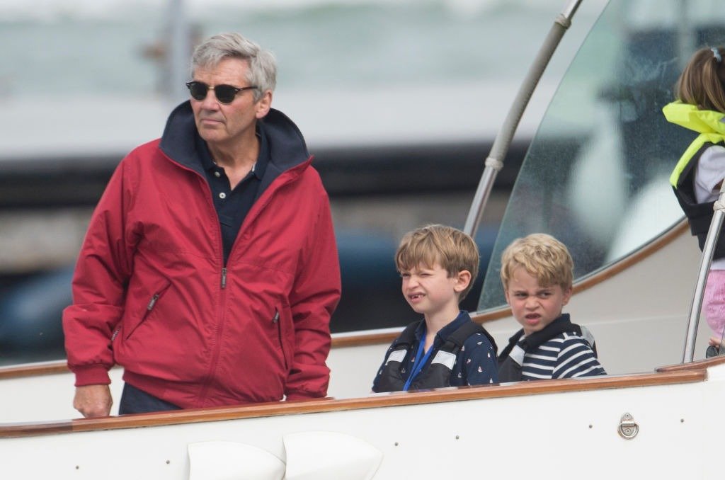 Michael Middleton (L) with Prince George (R) at The Royal Yacht Squadron during the inaugural Kings Cup regatta hosted by the Duke and Duchess of Cambridge on August 08, 2019 in Cowes, England. | Photo: Getty Images