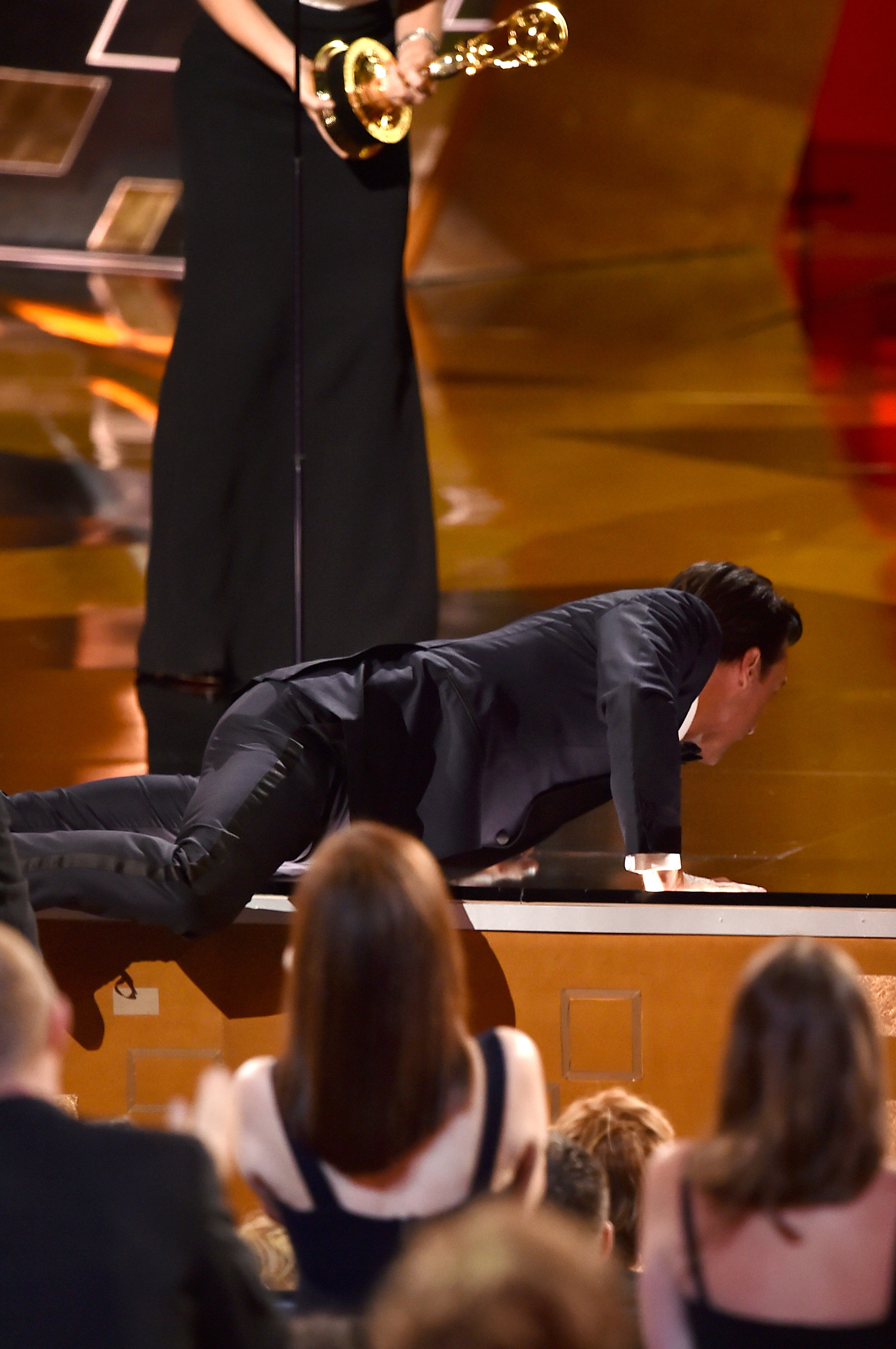 Jon Hamm climbing onstage to accept the Outstanding Lead Actor in a Drama Series award for "Mad Men" during the 67th Annual Primetime Emmy Awards on September 20, 2015, in Los Angeles, California. | Source: Getty Images
