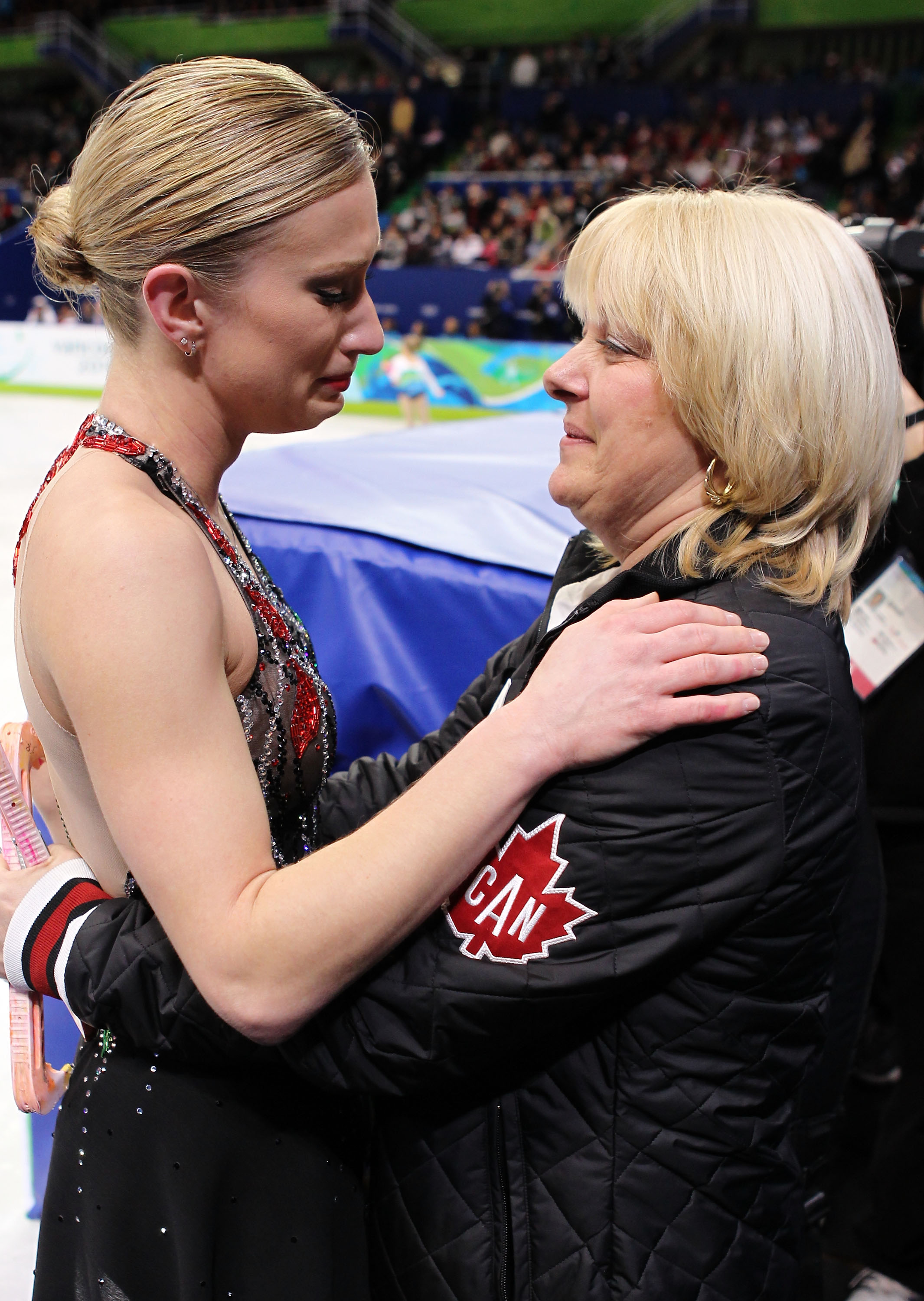 Joannie Rochette (L) embraces her coach Manon Perron on February 23, 2010, in Vancouver, Canada | Source: Getty Images