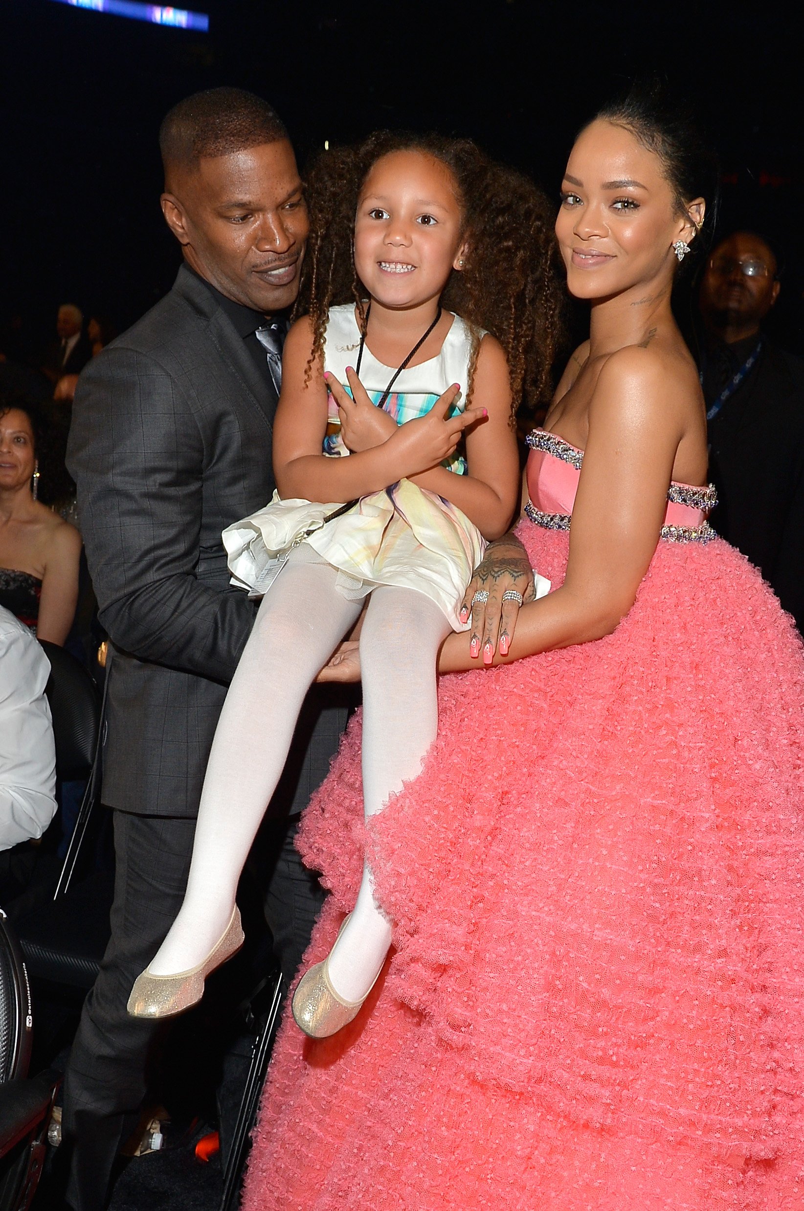 Jamie Foxx, Annalise Bishop, and Rihanna at the 57th Annual Grammy Awards on February 8, 2015 | Source: Getty Images