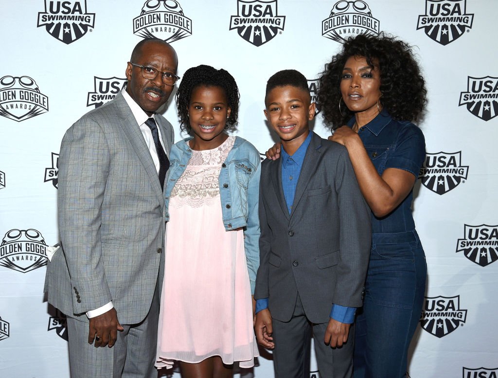 Courtney B. Vance, Bronwyn Vance, Slater Vance and Angela Bassett at the USA Swimming Golden Goggle Awards on Nov. 19, 2017, in California | Photo: Getty Images