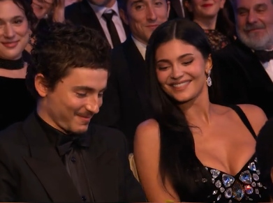 Timothée Chalamet and Kylie Jenner smiling after receiving a snack from Alan Cumming at the 79th BAFTA Film Awards dated February 22, 2026 | Source: TikTok/bbc