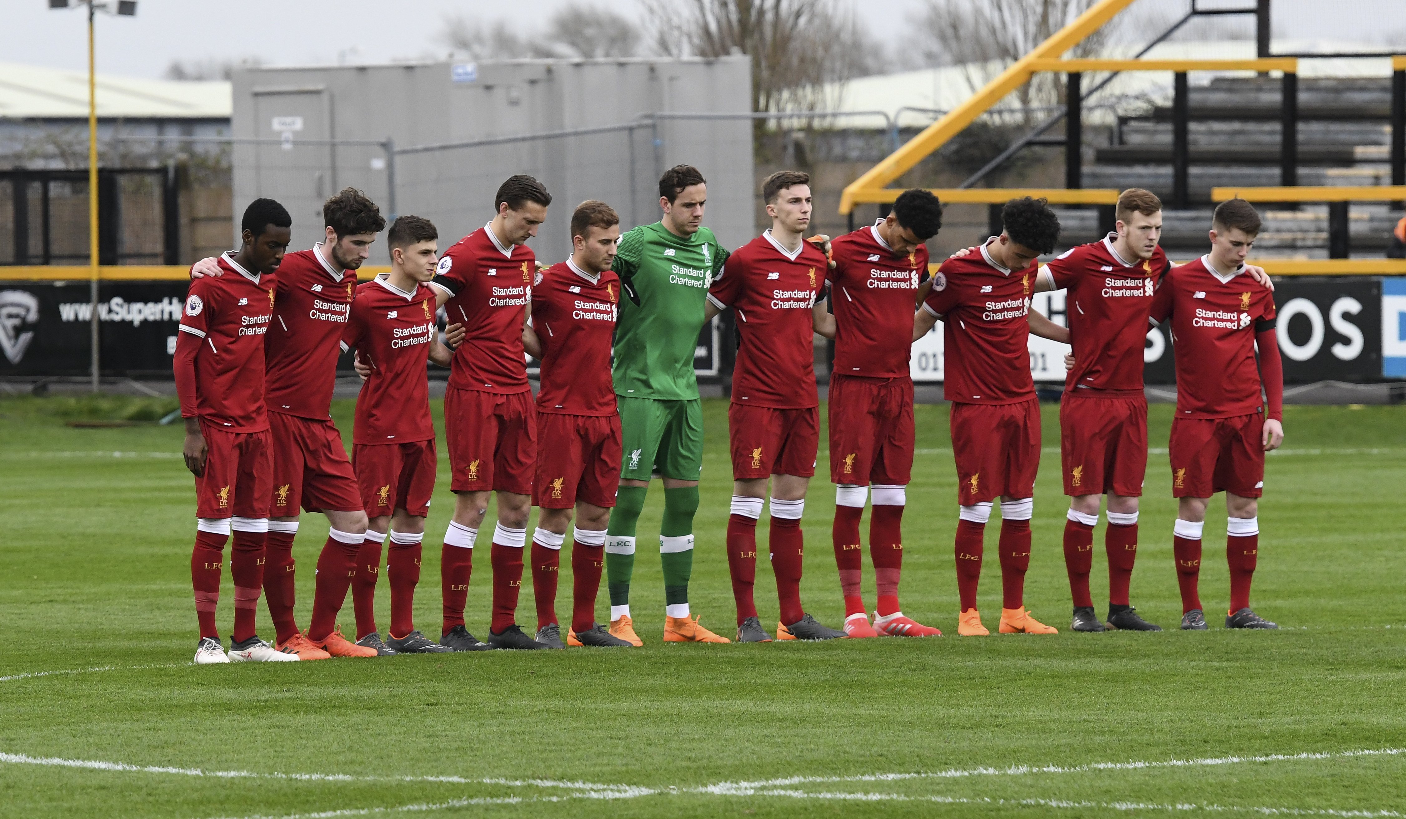 The Liverpool players observe a minute silence for the victims of the Hillsborough disaster on April 16, 2018 in Southport, England. | Source: Getty Images