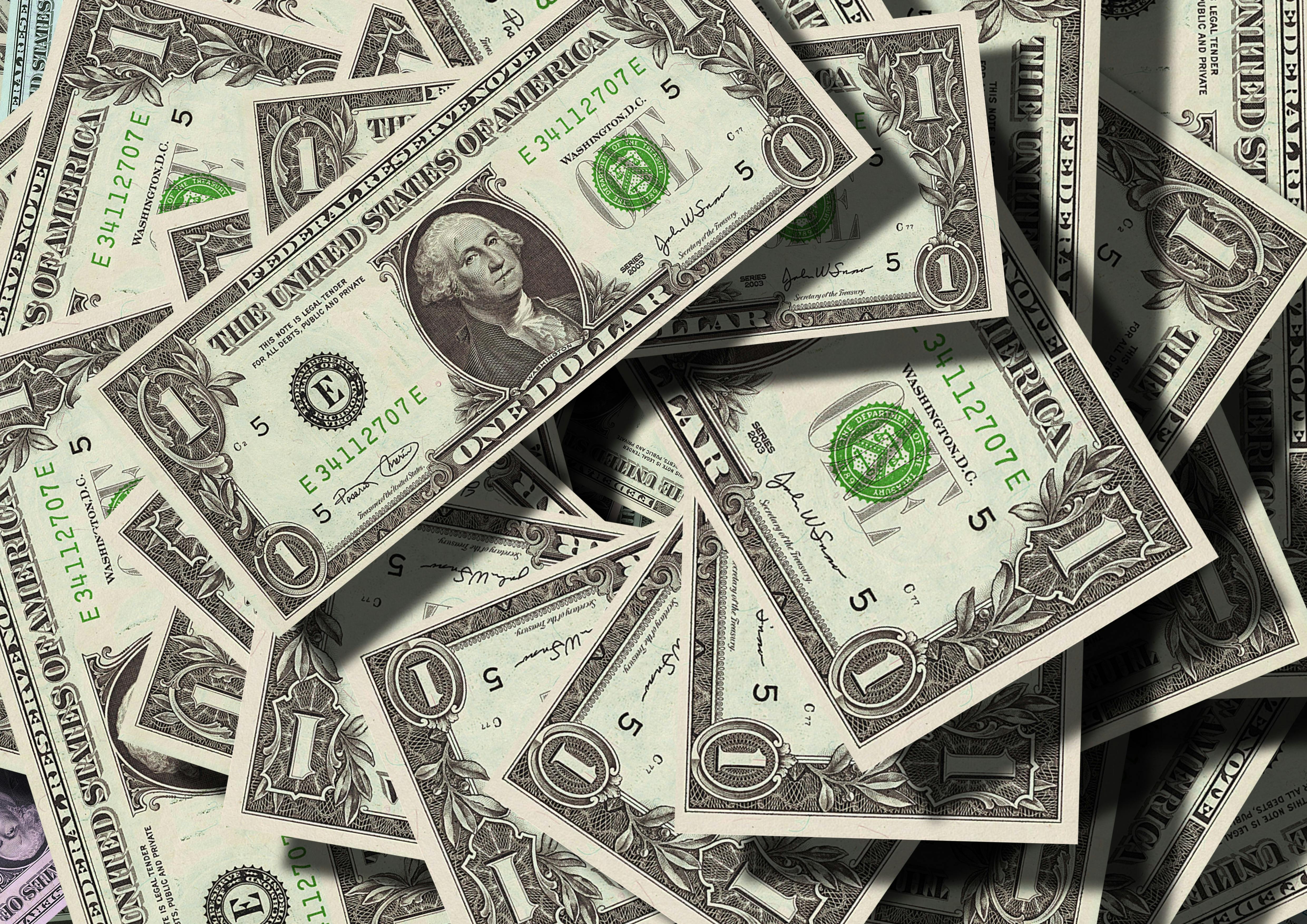A pile of one dollar bills | Source: Pexels