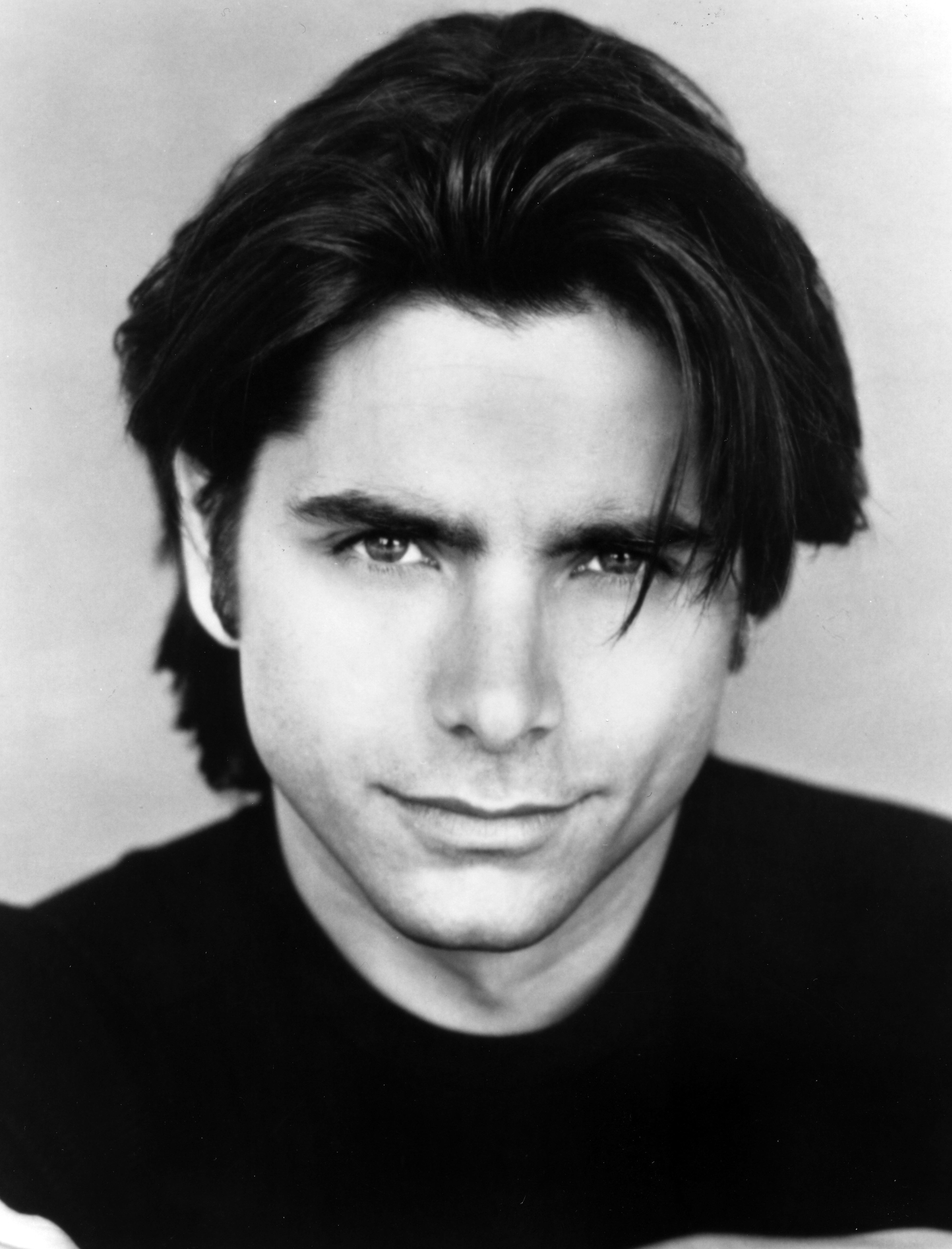 A black and white headshot of musician John Stamos on September 15, 1993 | Source: Getty Images