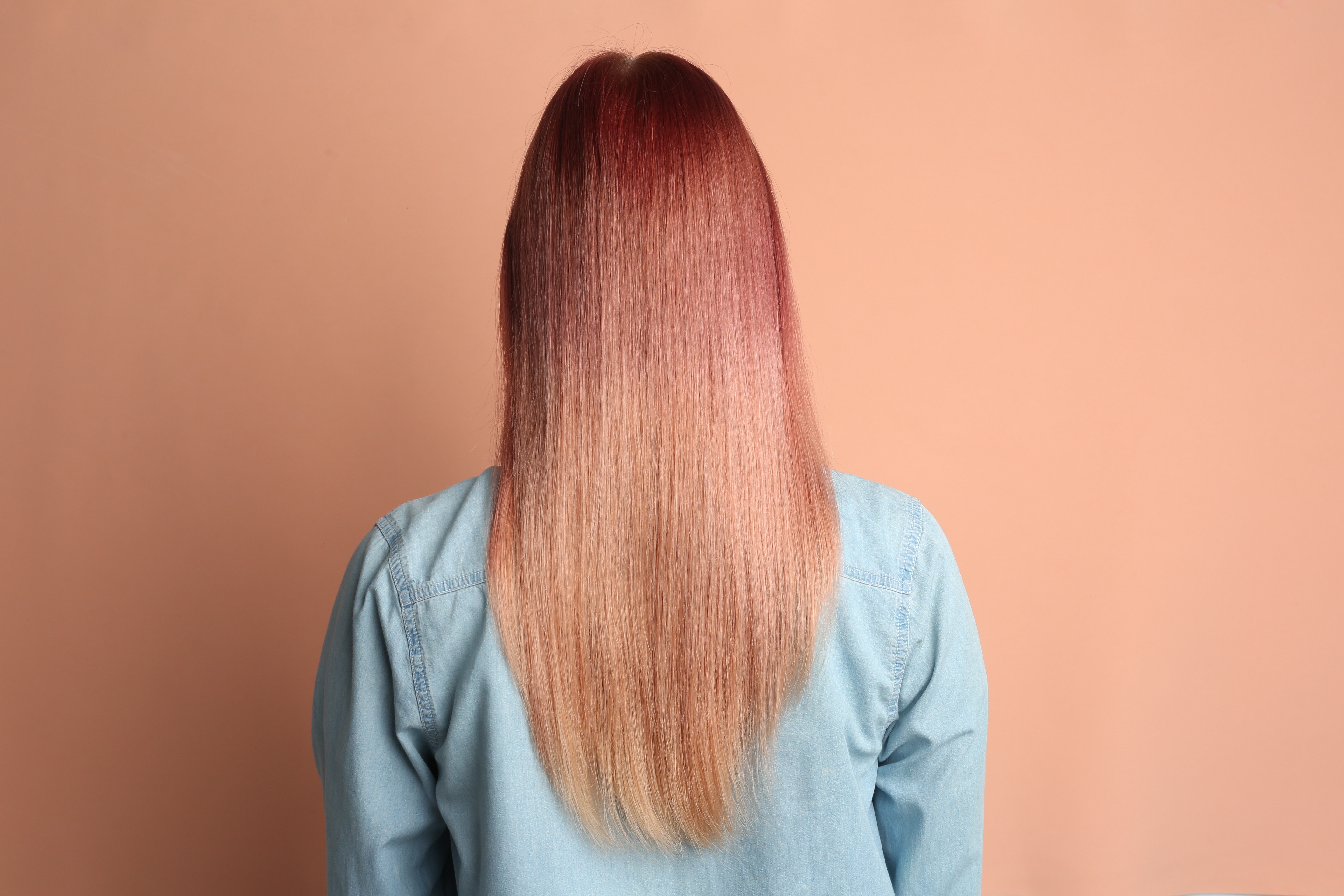 Woman with straight rose gold hair | Source: Shutterstock