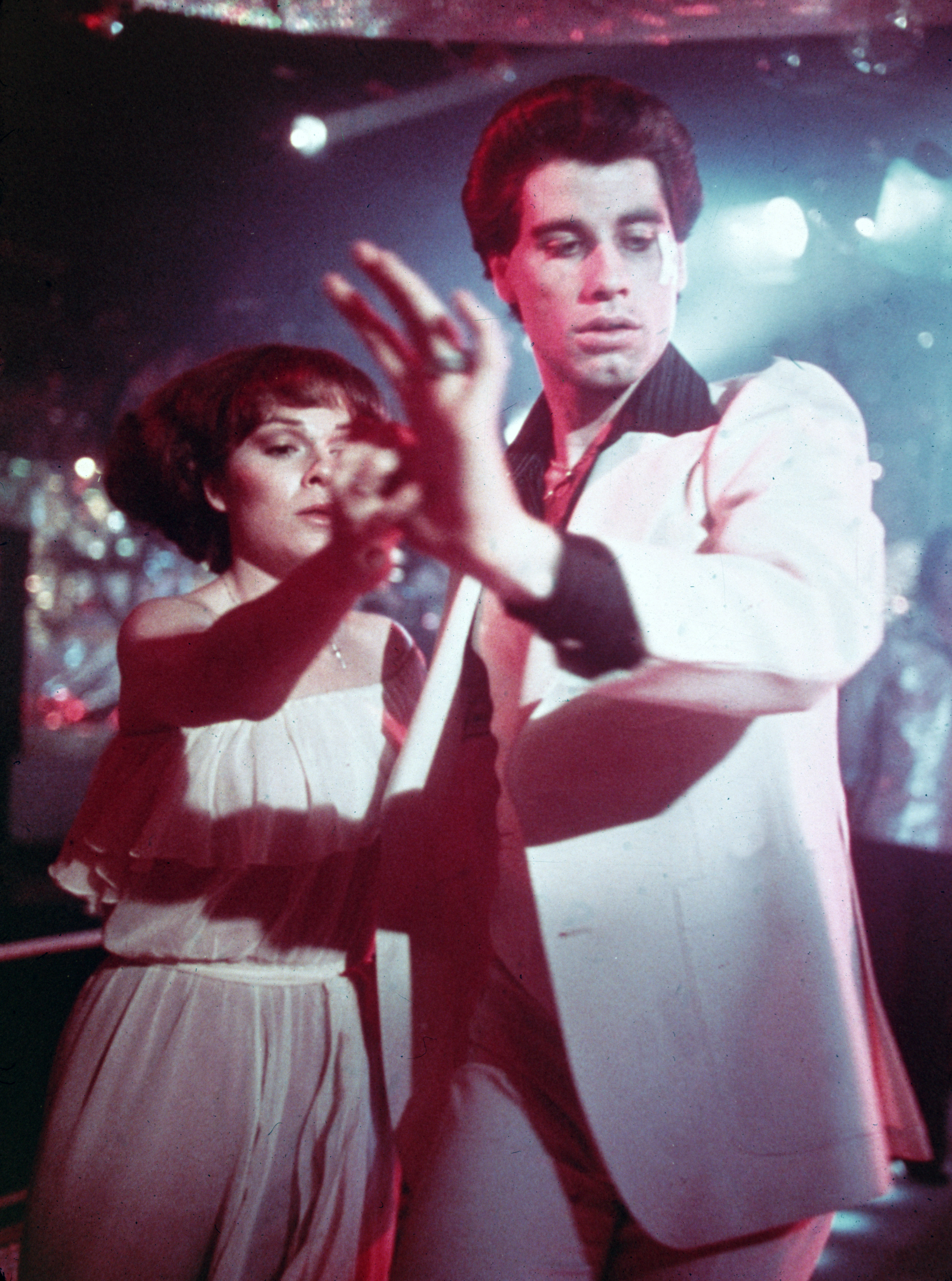 John Travolta and the actress shooting "Saturday Night Fever" in 1977. | Source: Getty Images