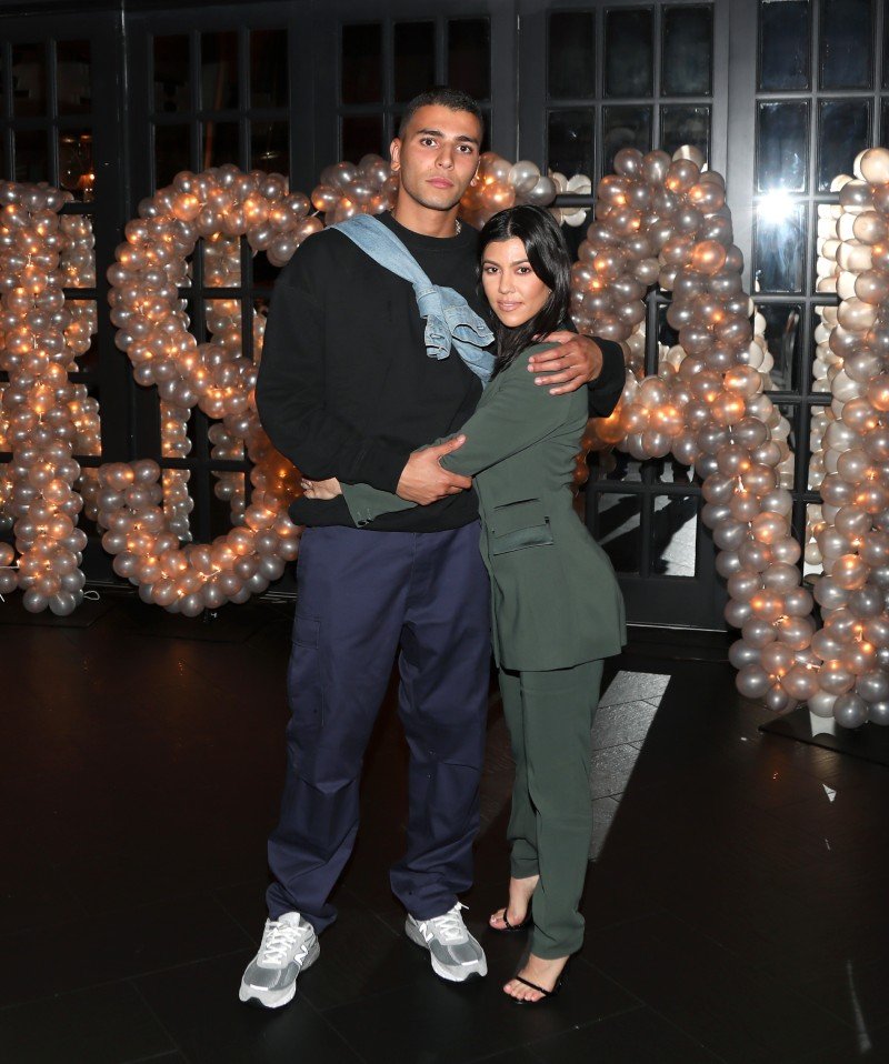 Younes Bendjima and Kourtney Kardashian posing for a photo on Tristan Thompson's birthday at Beauty & Essex, Los Angeles, California, in March 2018. | Image: Getty Images.