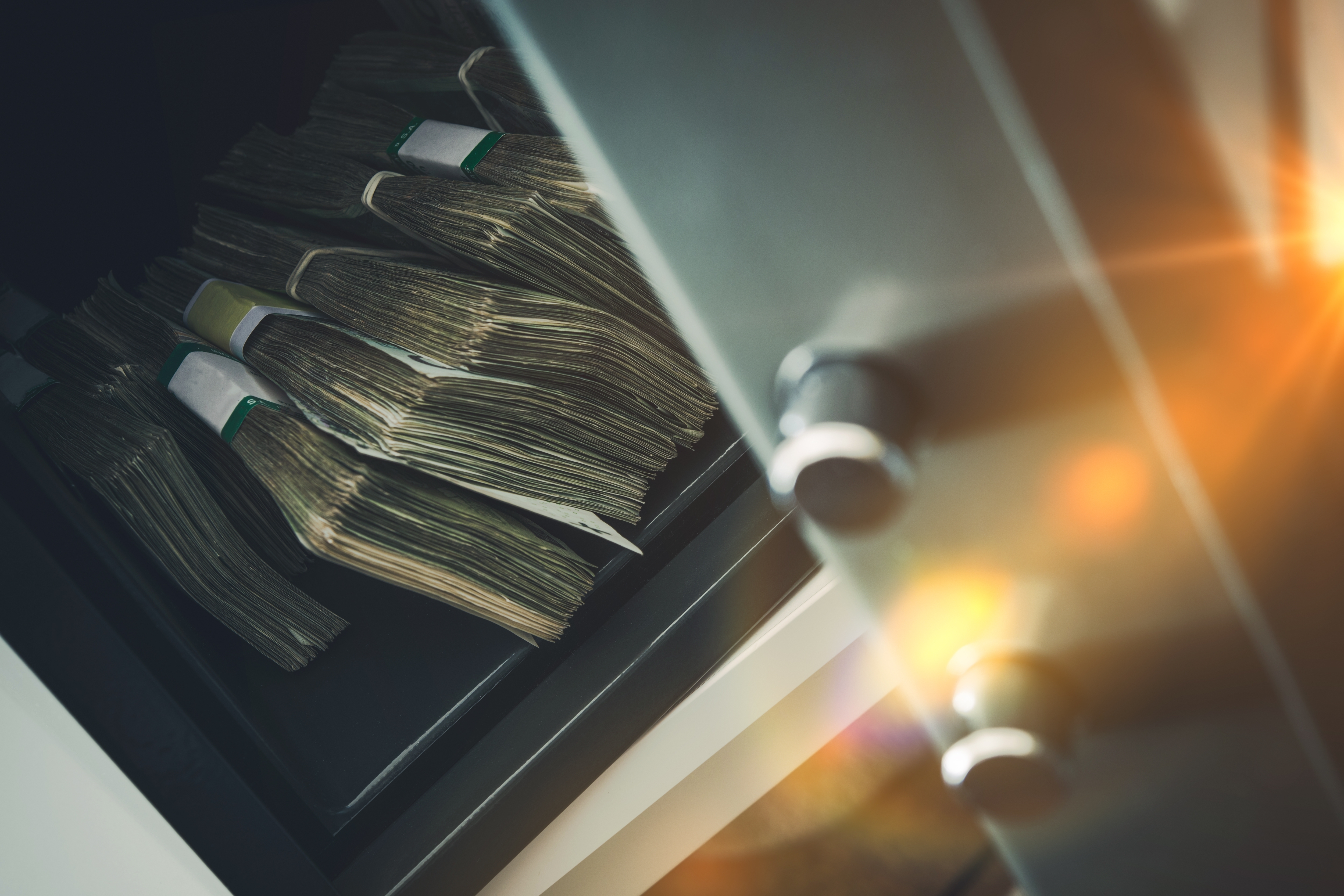 Small Residential Vault with Pile of Cash Money. | Source: Shutterstock