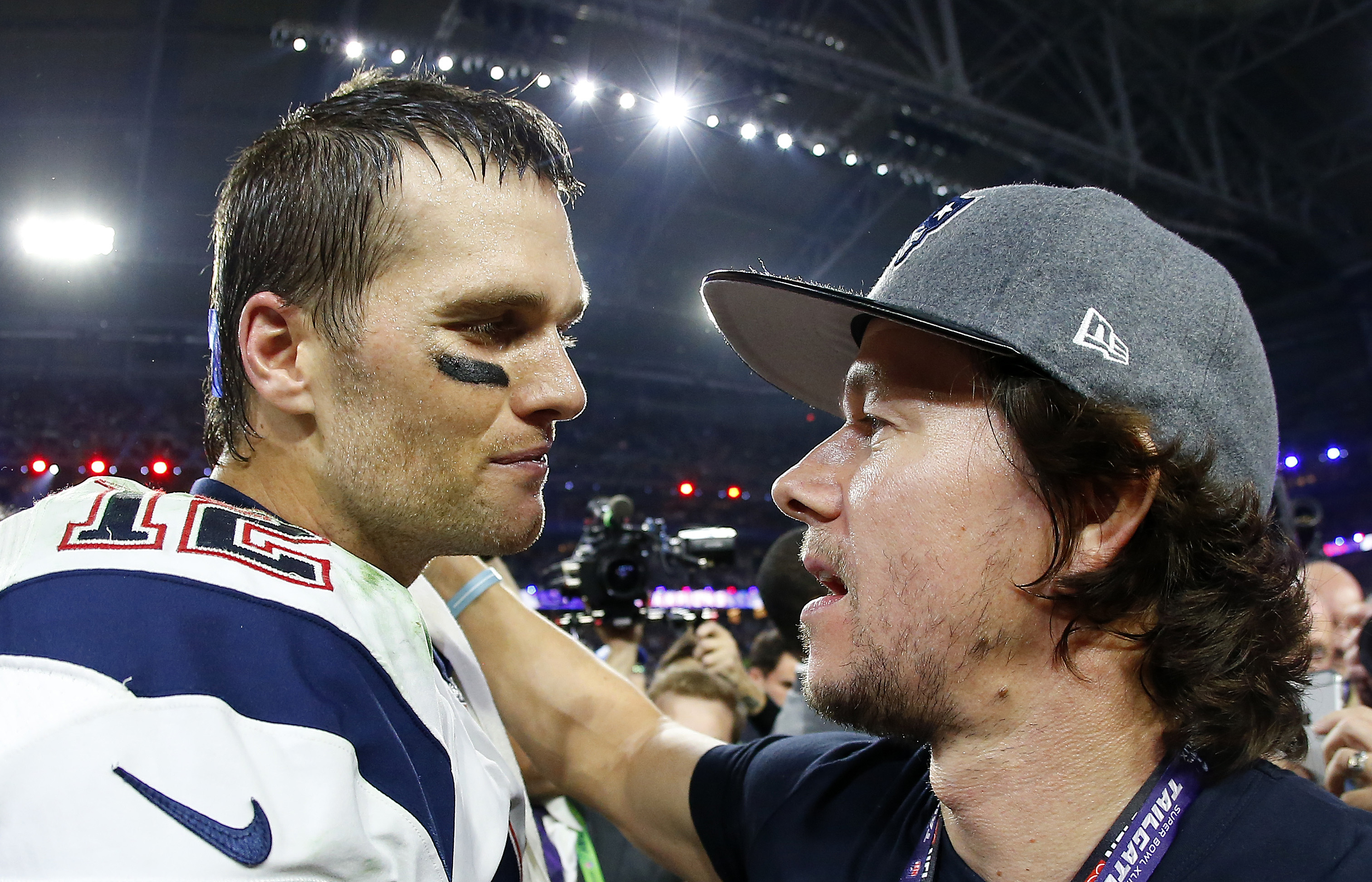 Tom Brady celebrates with Mark Wahlberg after defeating the Seattle Seahawks 28-24 to win Super Bowl XLIX on February 1, 2015 | Source: Getty images