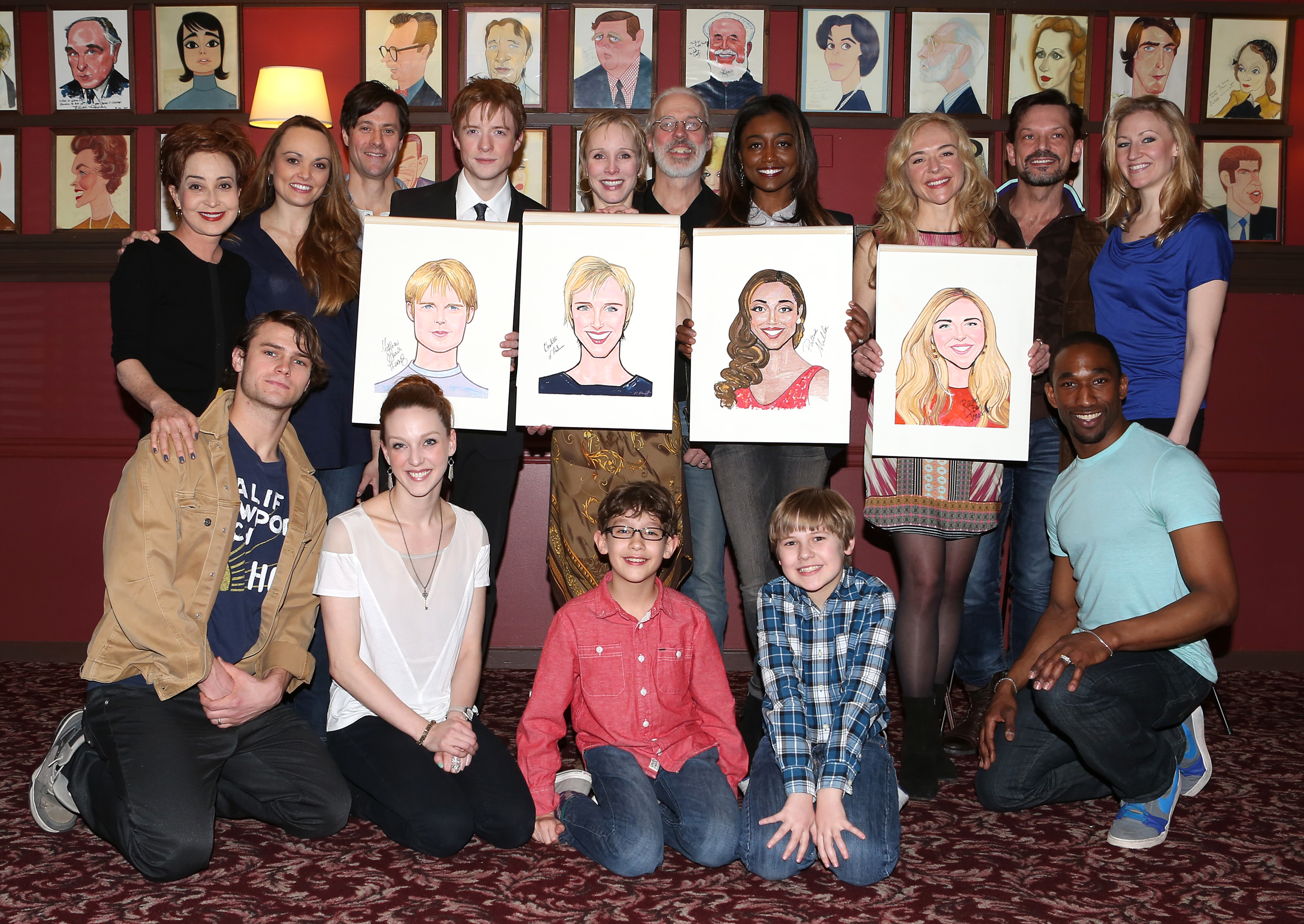 Annie Potts posing with the cast of "Pippin" at a Caricature Unveiling in New York City on March 11, 2014 | Source: Getty Images