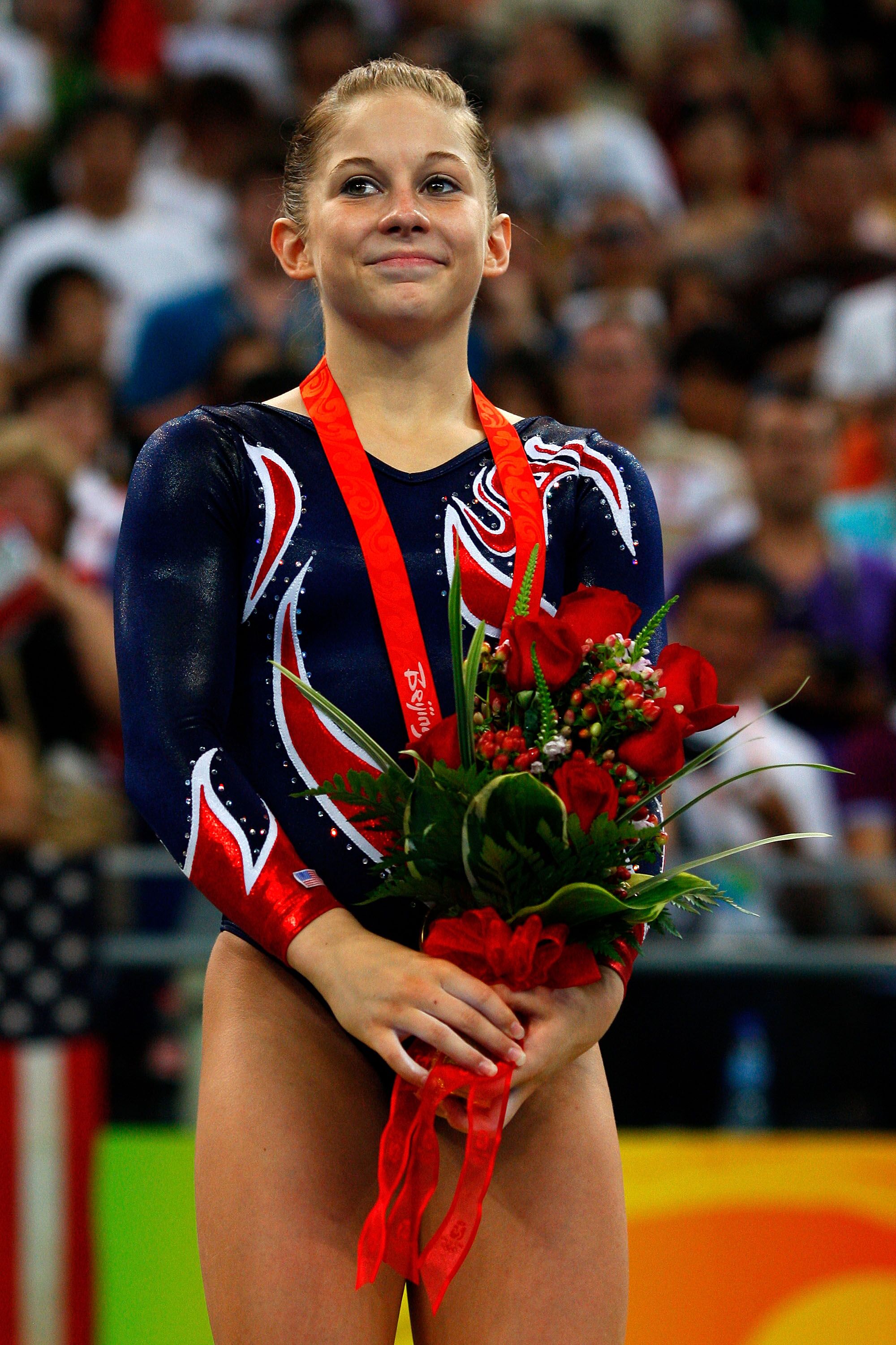  Shawn Johnson of the USA smiles as she stands on the podium during the medal ceremony for the Women's Beam Final at the National Indoor Stadium on Day 11 of the Beijing 2008 Olympic Games on August 19, 2008 in Beijing, China | Photo: Getty Images 