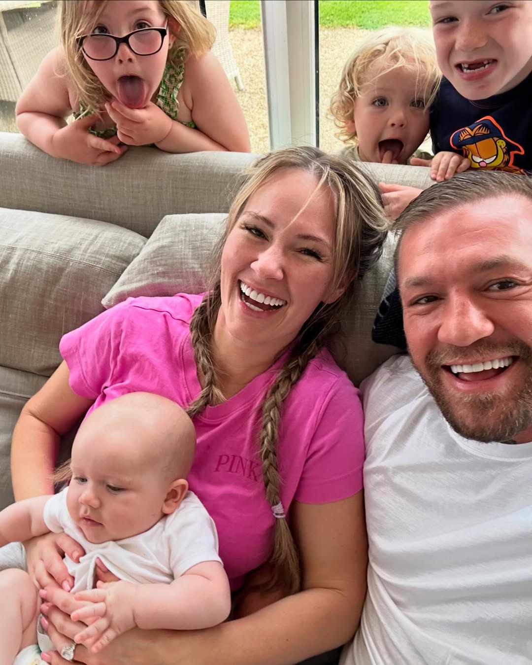 Dee Devlin and Conor McGregor with their children from a post dated December 14, 2024. | Source: Instagram/thenotoriousmma