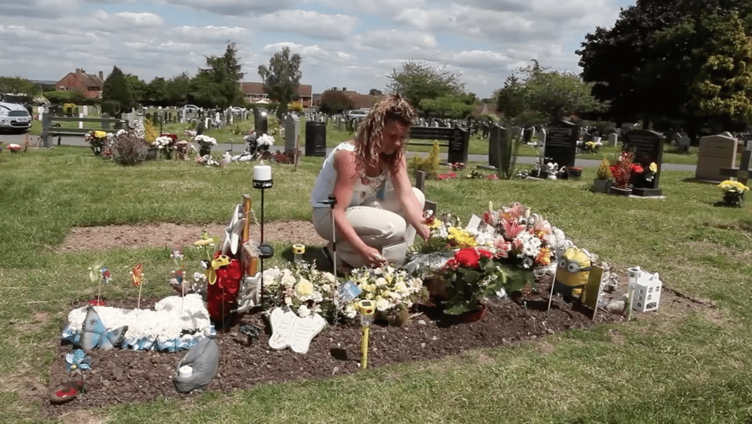 Jo Corbett-Weeks visiting her son's grave. | Source: dailymotion.com/SWNS