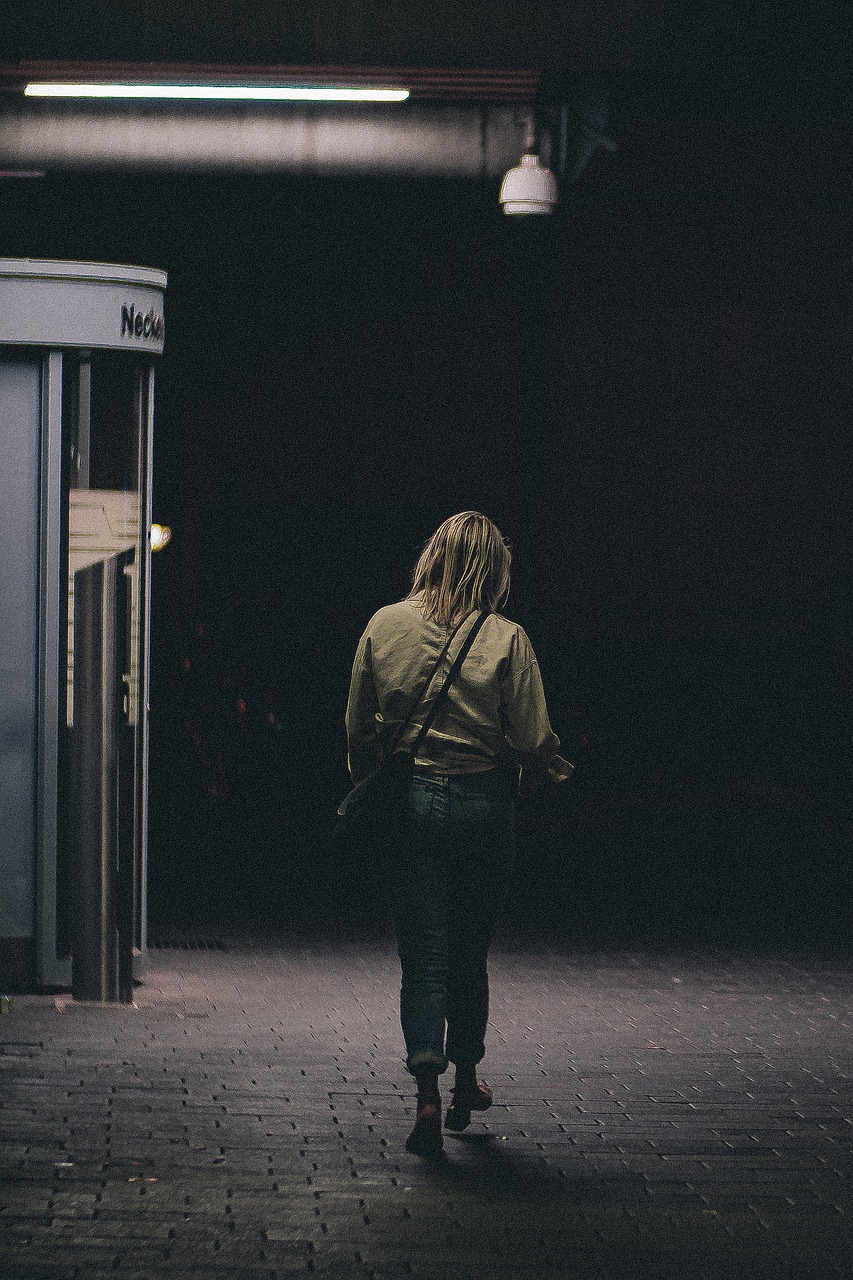 Person walking at night | Source: Pixabay