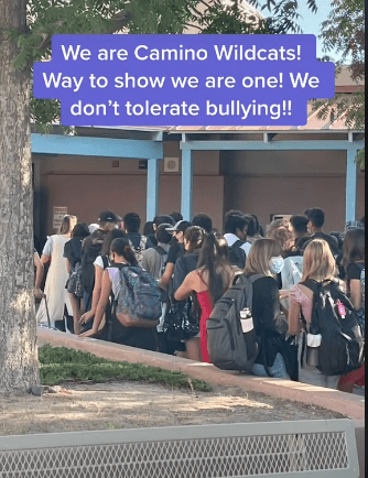 Students at Camino Real Middle School gather to escort a seventh-grade student to class. | Source: tiktok.com/575_msjanice
