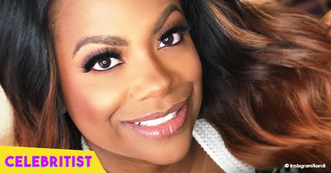Kandi Burruss shows off ample cleavage in gold dress in pic with husband and Cynthia Bailey 