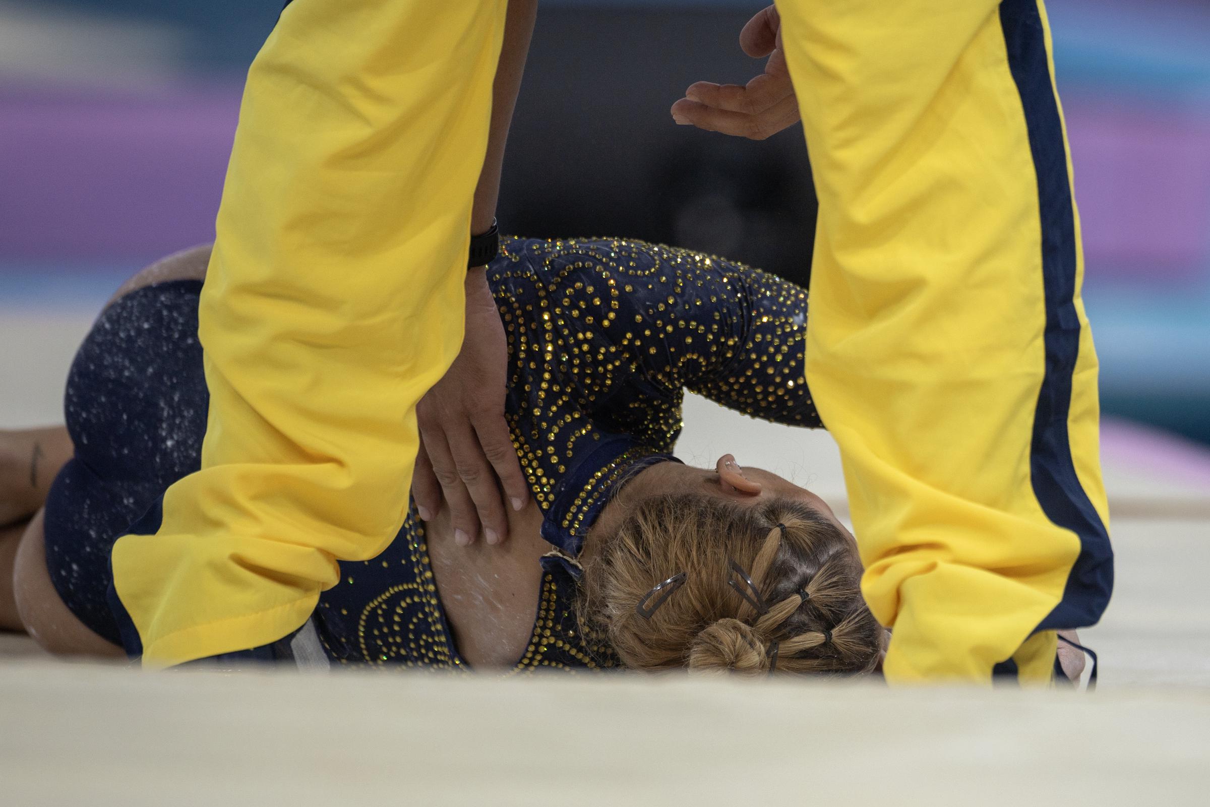 Flavia Saraiva after injuring herself during horizontal bars warm up during the Artistic Gymnastics Team Final for Women on July 30, 2024, in Paris, France. | Source: Getty Images