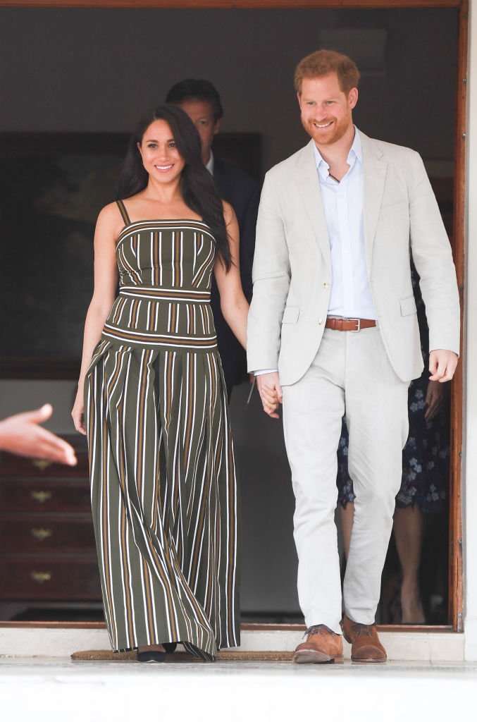 Prince Harry and Meghan attend a reception at the Residence of the British High Commissioner, during the royal tour of South Africa.| Source: Getty Images