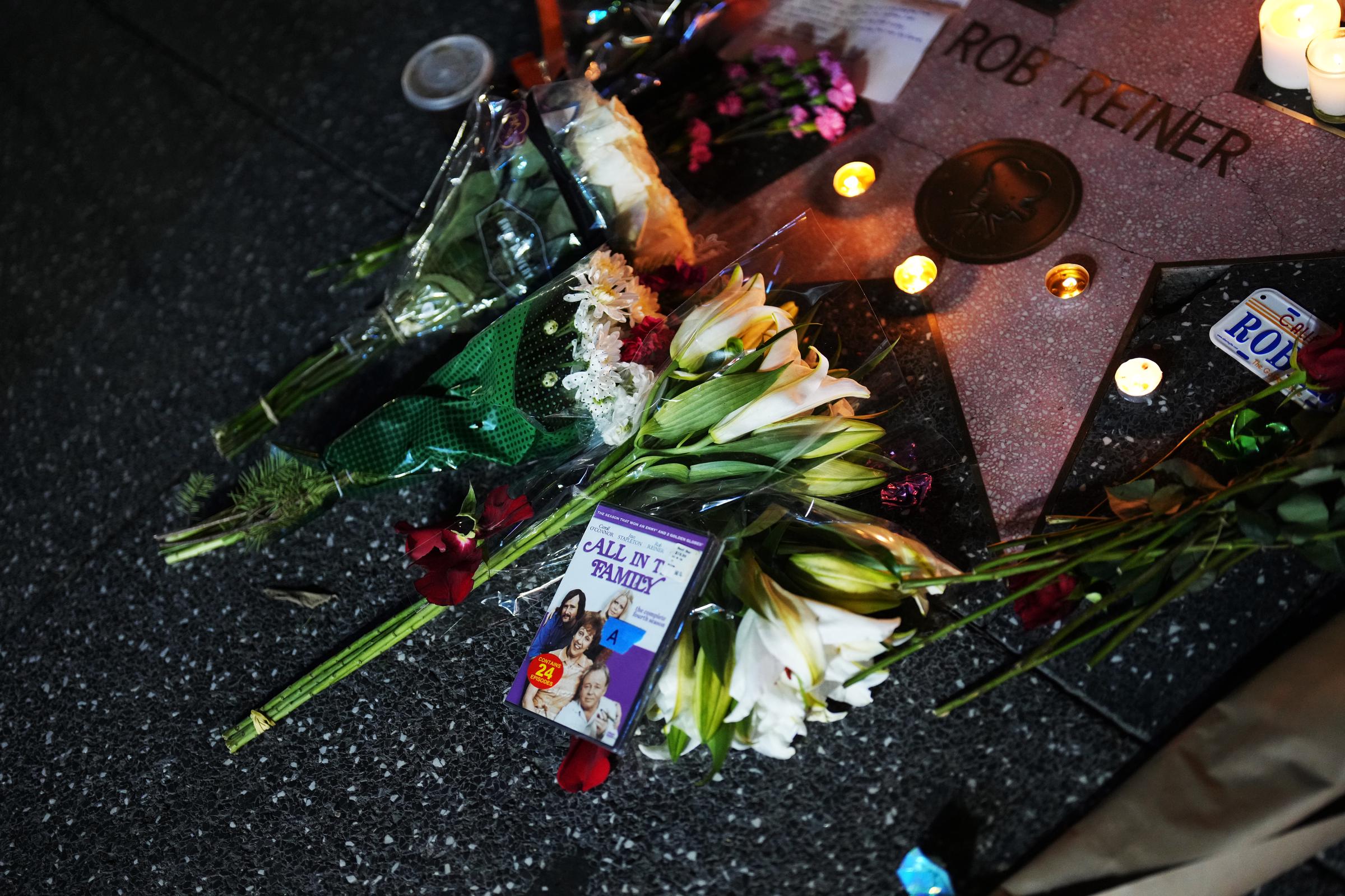 Flowers and candles are placed on director/actor Rob Reiner's Star on the Hollywood Walk of Fame on December 15, 2025