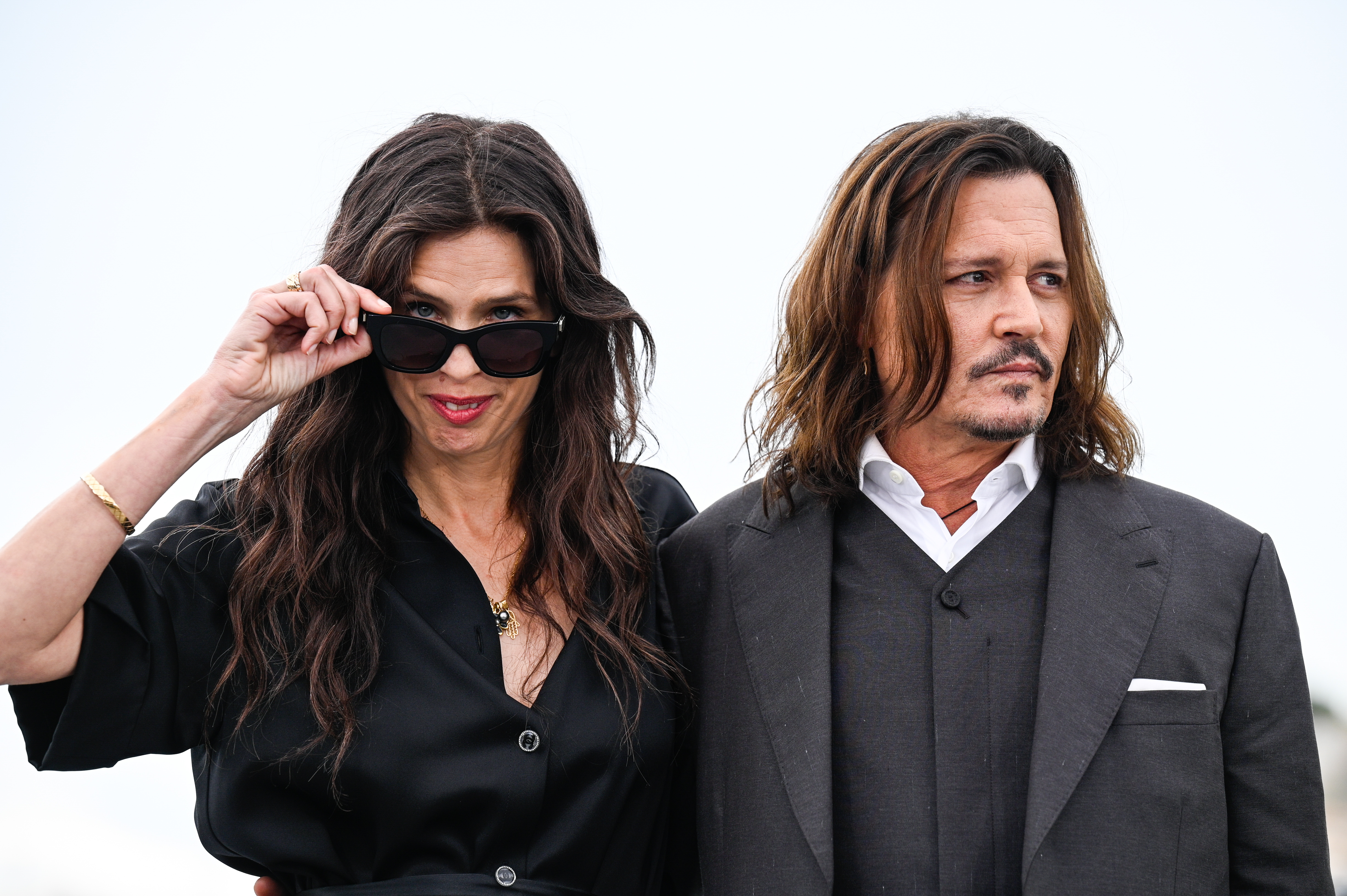 Maïwenn and Johnny Depp attends the "Jeanne du Barry" photocall at the 76th annual Cannes film festival at Palais des Festivals on May 17, 2023, in Cannes, France. | Source: Getty Images
