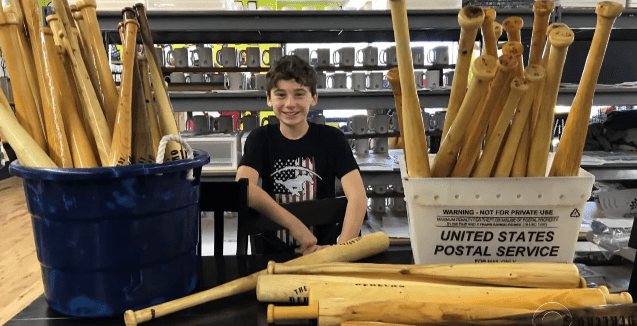Tommy Rhomberg and the bats he made to raise money for his community | Photo: YouTube/CBS Evening News