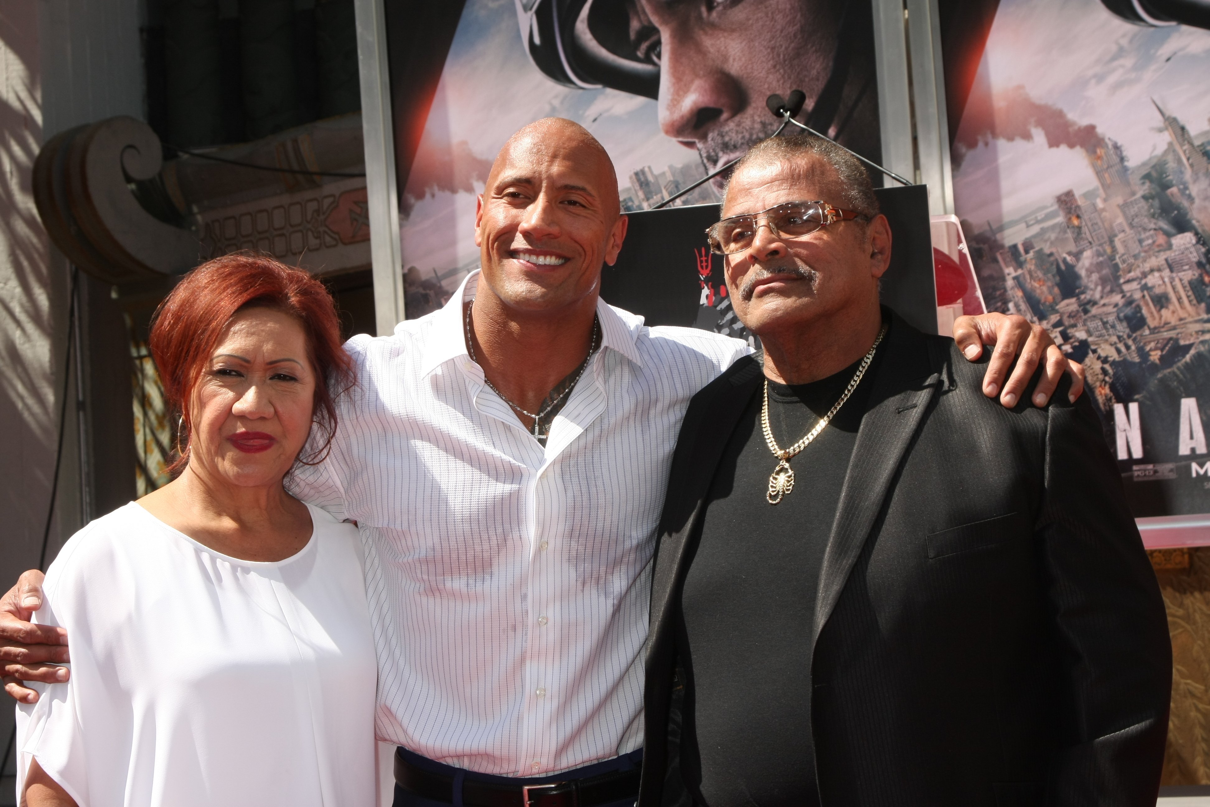 Dwayne Johnson pictured with his mom, Ata Johnson, and dad, Rocky Johnson, at his Hand and Foot Print Ceremony at the TCL Chinese Theater, 2015. California | Photo: Shutterstock