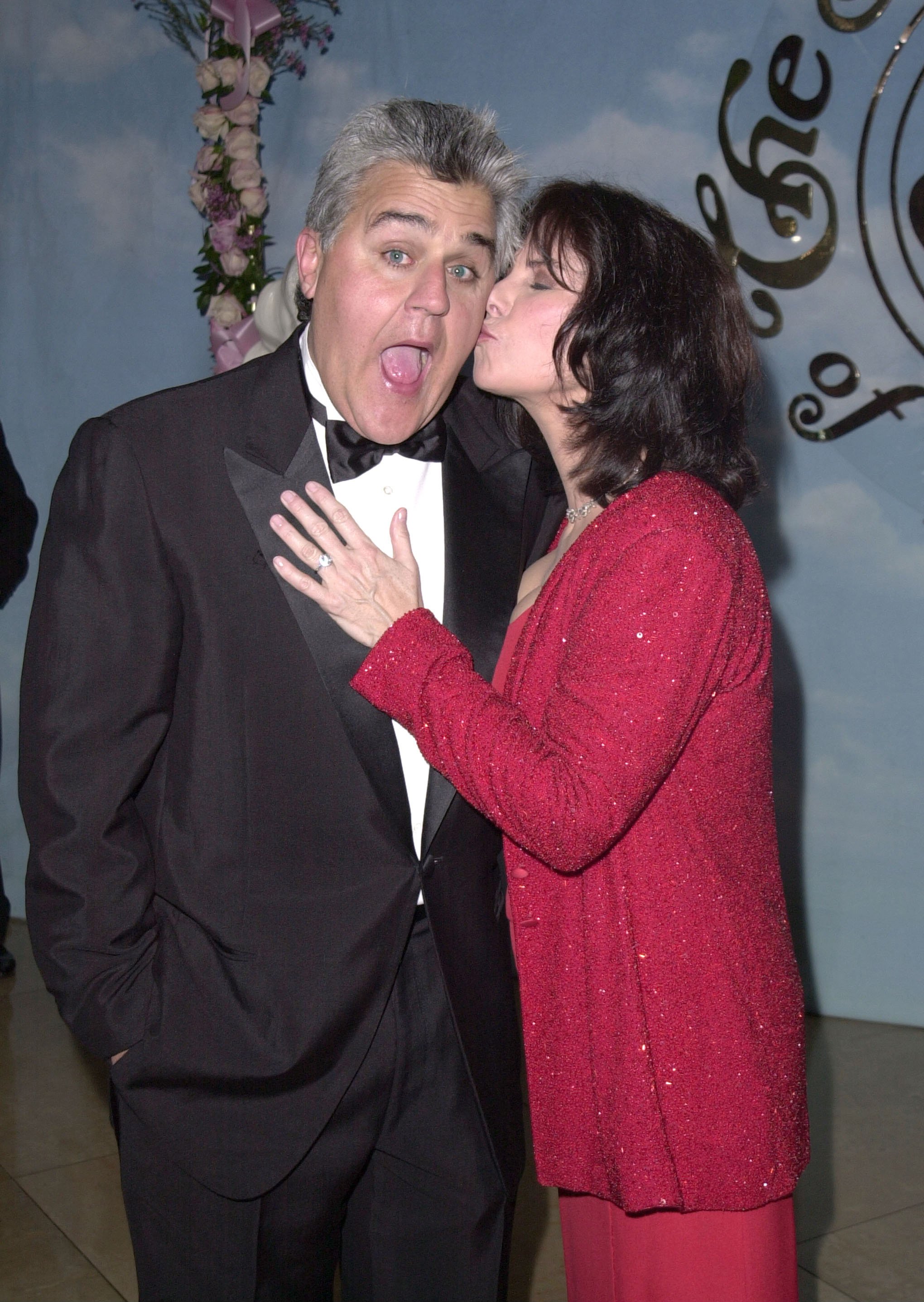 Mavis Leno kisses her husband Jay Leno's cheek during the 14th Carousel of Hope Ball for Barbara Davis Center for Diabetes at Beverly Hills Hilton Hotel in Beverly Hills, California. | Source: Getty Images