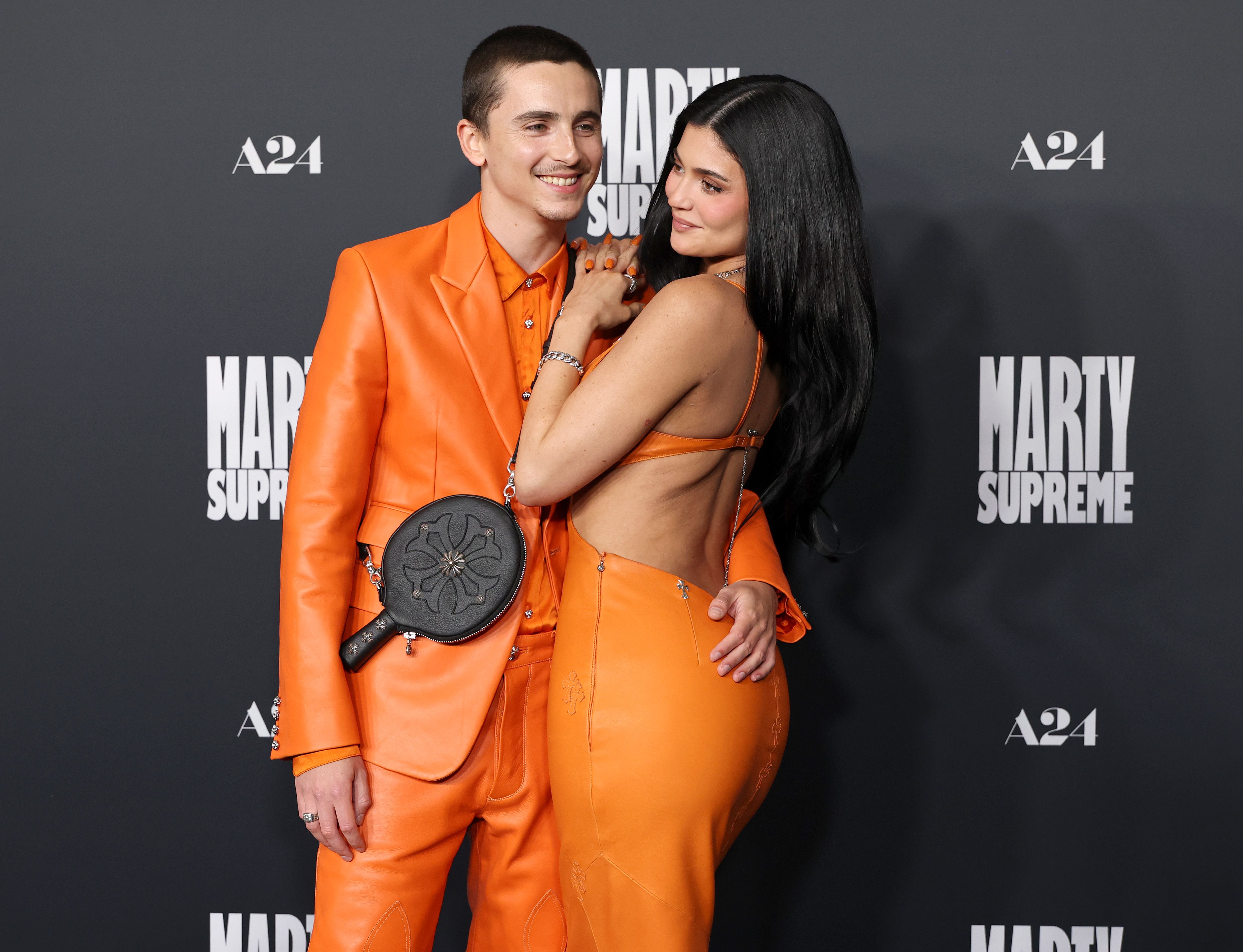 Timothée Chalamet and Kylie Jenner share a moment on the black carpet at the "Marty Supreme" premiere in Beverly Hills, California, on December 8, 2025 | Source: Getty Images