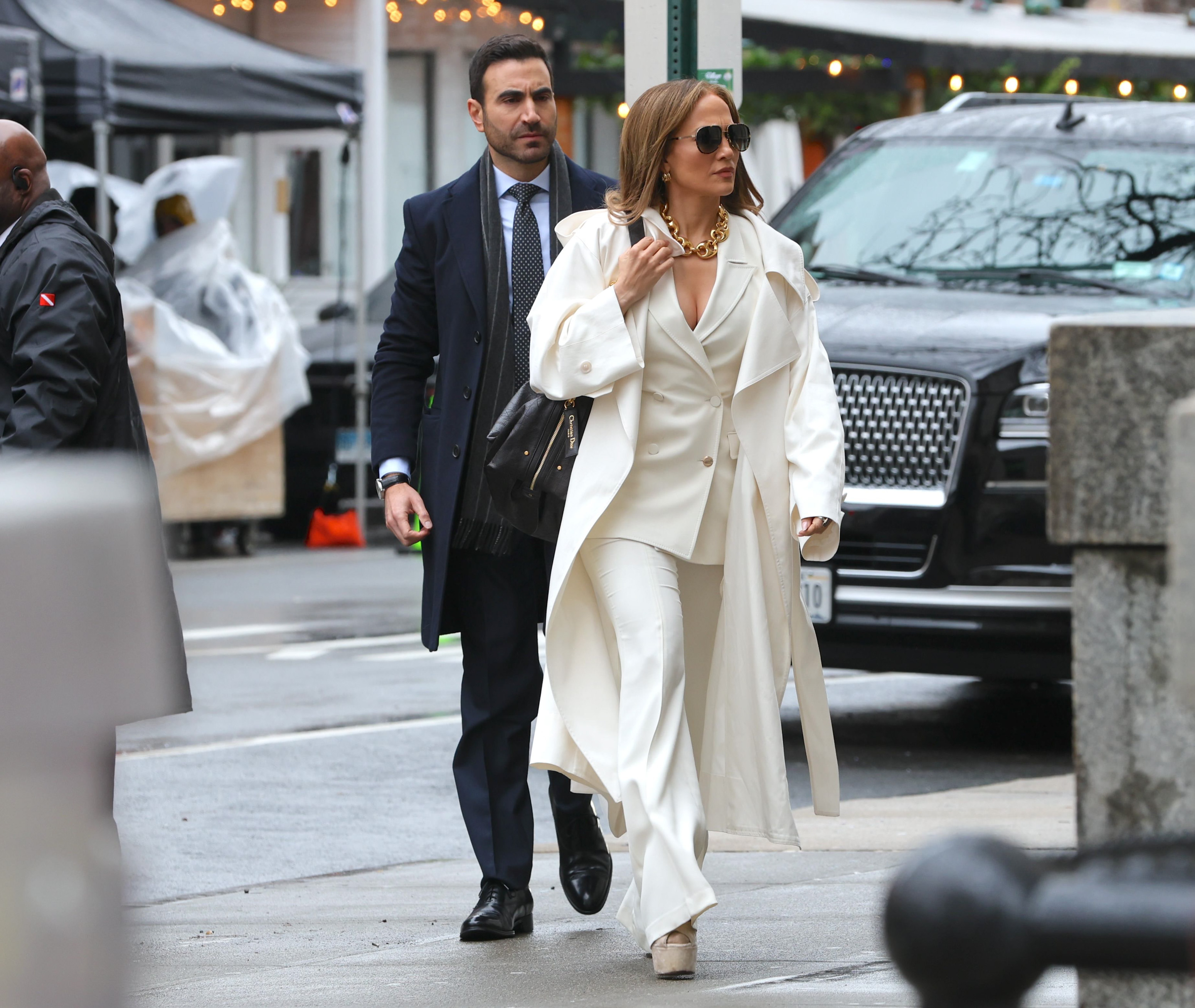 Brett Goldstein and Jennifer Lopez are seen filming on the "Office Romance" movie set on April 7, 2025 | Source: Getty Images