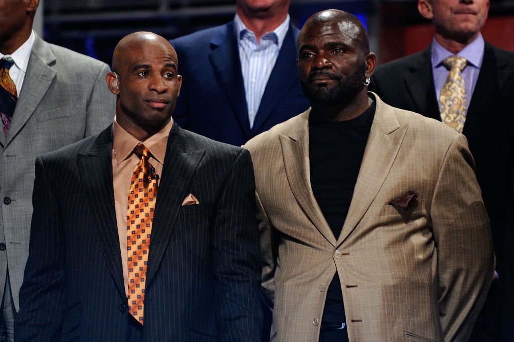 Former NFL Players Dieon Sanders and Lawrence Taylor stand on stage during the 2010 NFL Draft at Radio City Music Hall on April 22, 2010 | Photo: Getty Images