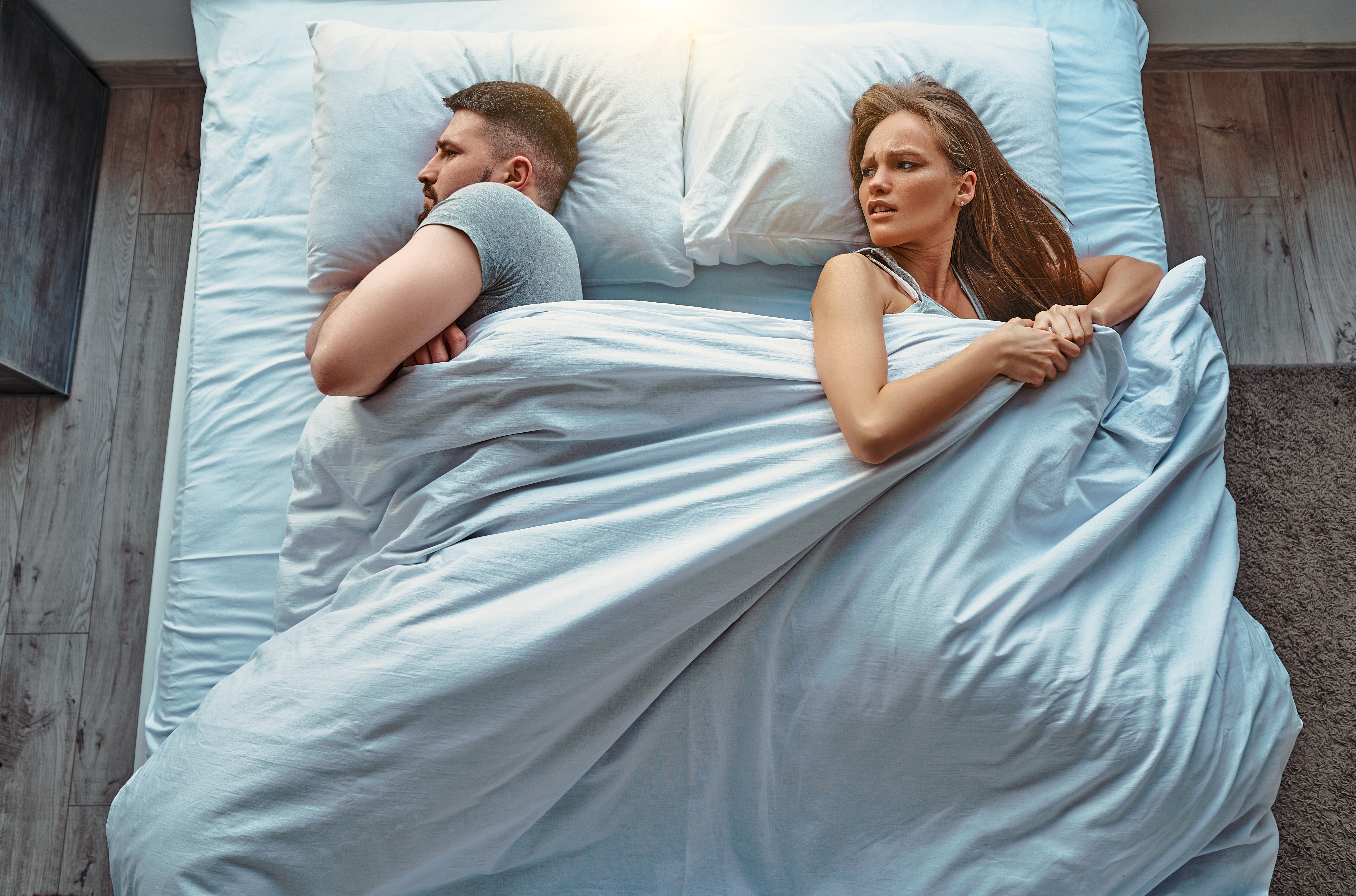 Man and woman fighting in bed | Source: Shutterstock