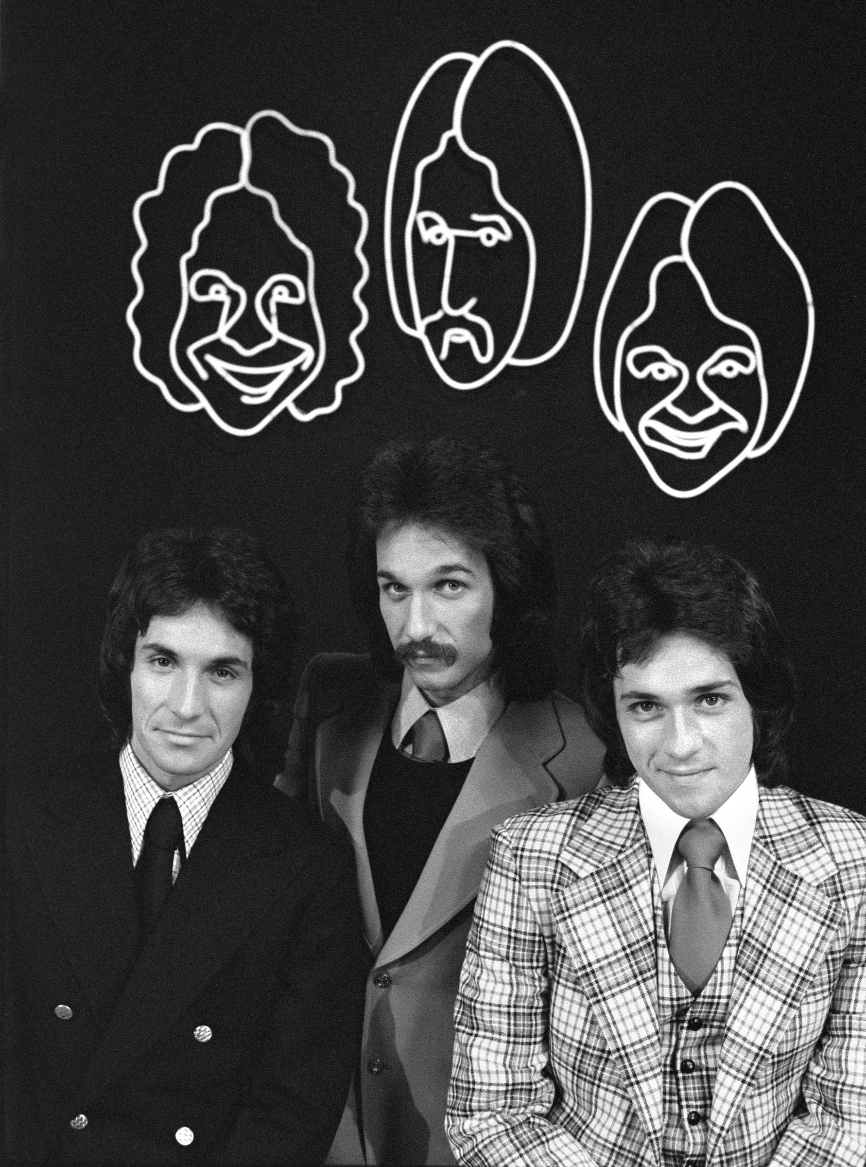 The Hudson Brothers (Bill, Mark, and Brett Hudson) posing for a photo during a taping of their morning sketch comedy series: "The Hudson Brothers Razzle Dazzle Show" on June 1, 1974. | Source: Getty Images