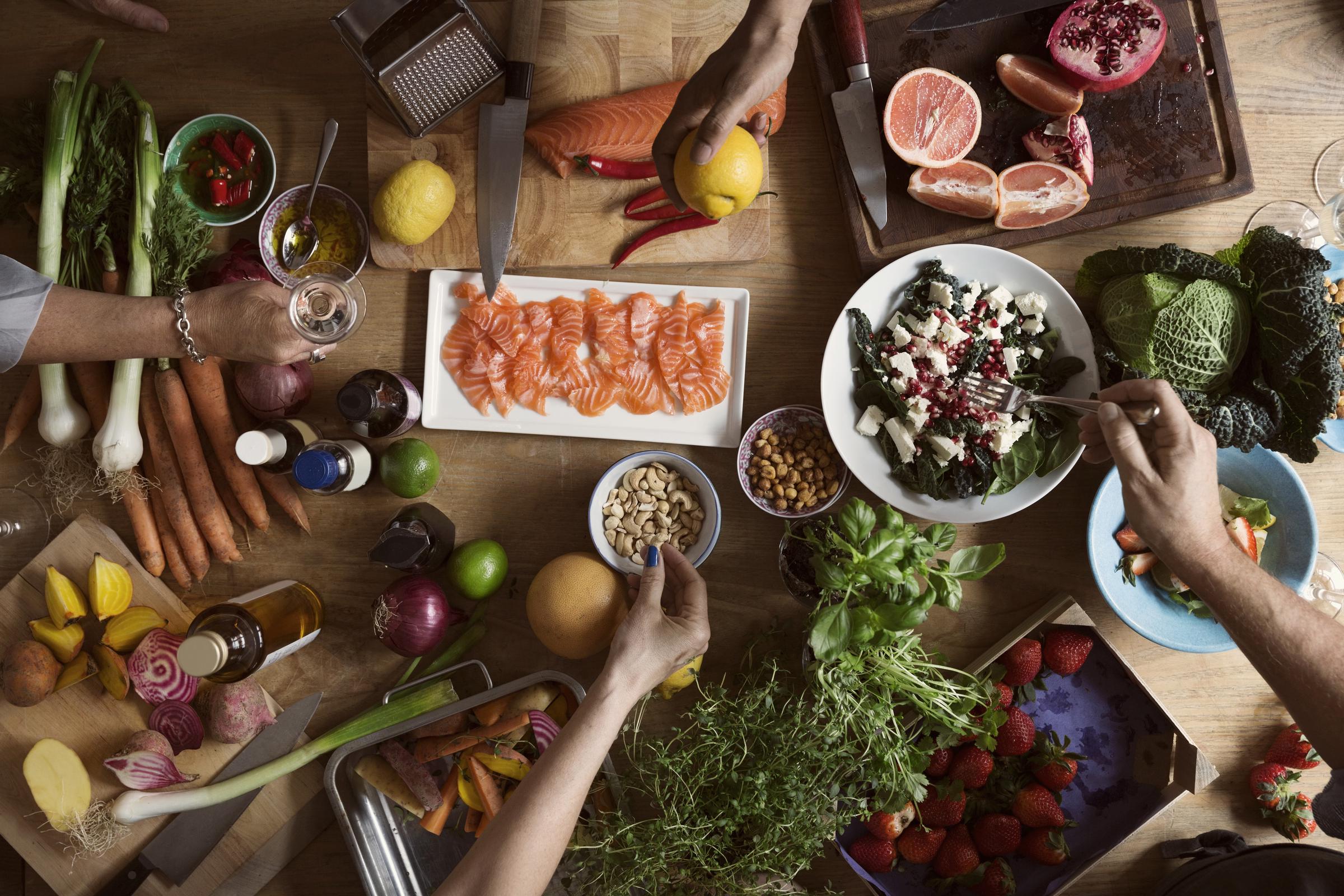 A group of people preparing food | Source: Getty Images