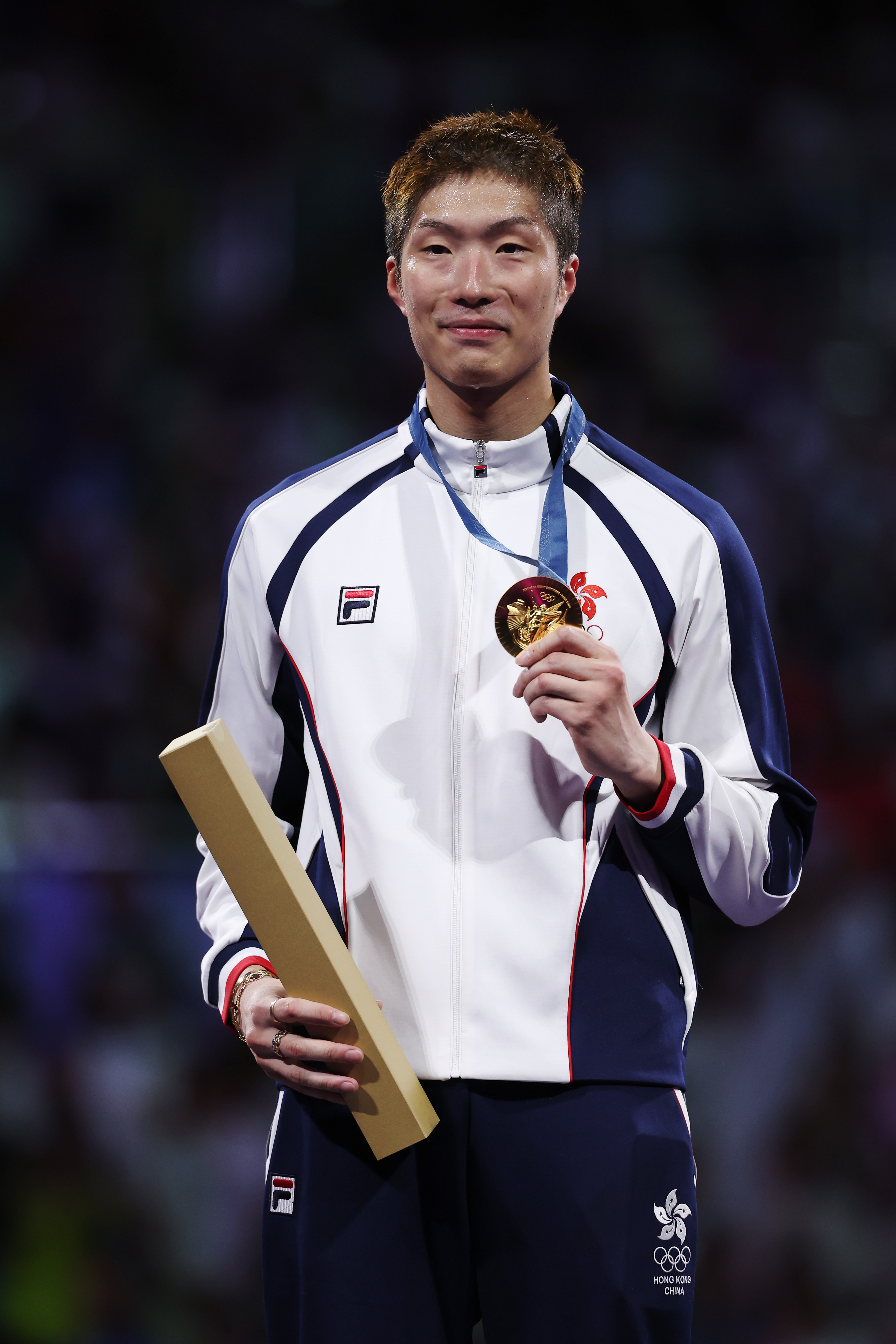 Ka Long Cheung from team Hong Kong celebrating his gold medal win during the Men's Foil Individual medal ceremony in Paris, France on July 29, 2024 | Source: Getty Images