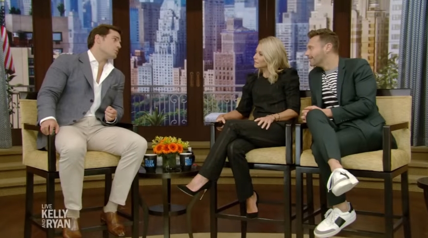 Henry Cavill appeared on "Live! With Kelly and Ryan" on July 24, 2018, as he sat down with Kelly Ripa and Ryan Seacrest to discuss his career and share a light-hearted family anecdote. | Source: YouTube/LiveKellyandMark