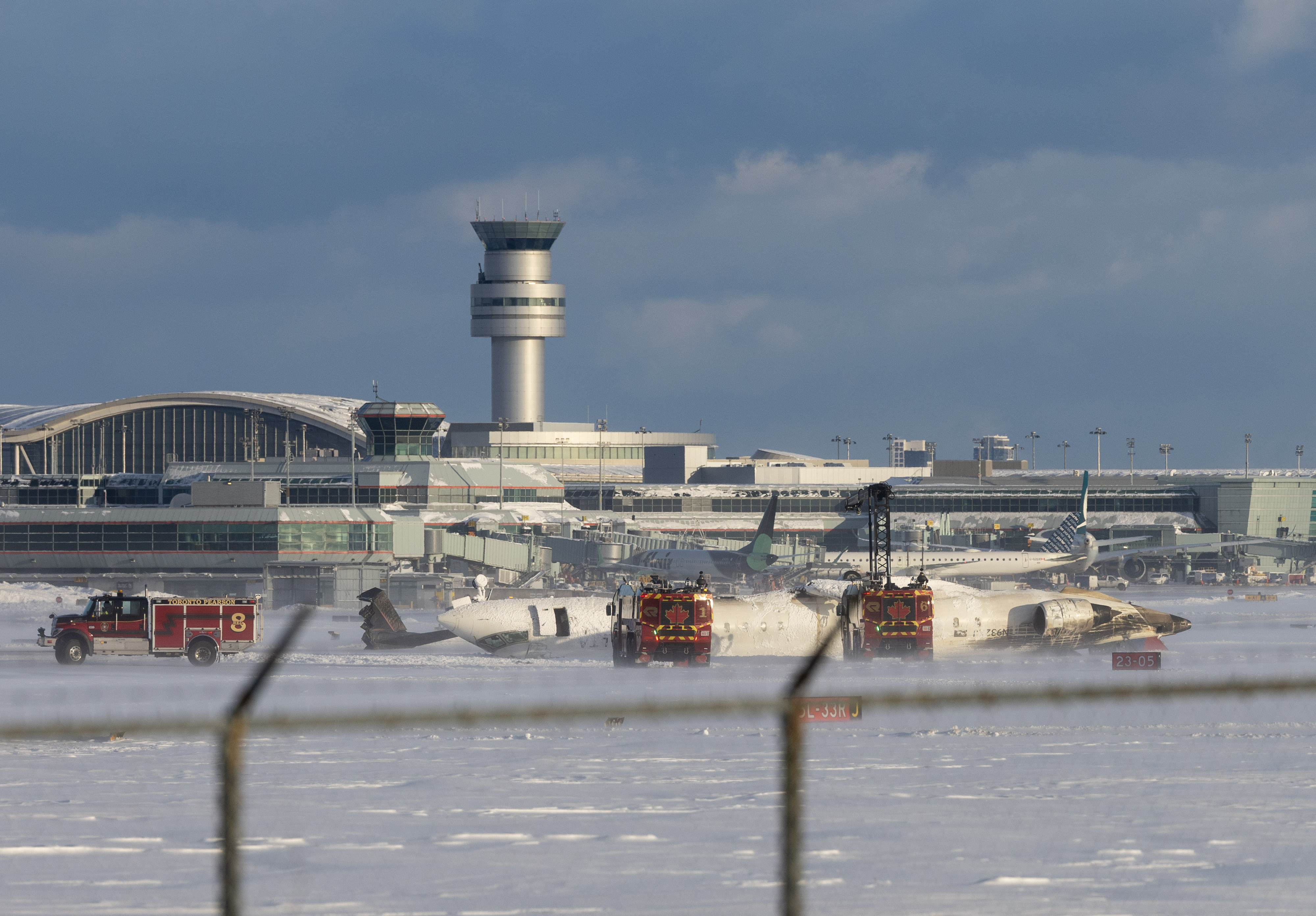 A Delta airlines plane heading from Minneapolis to Toronto sits upside-down on its roof after crash landing | Source: Getty Images