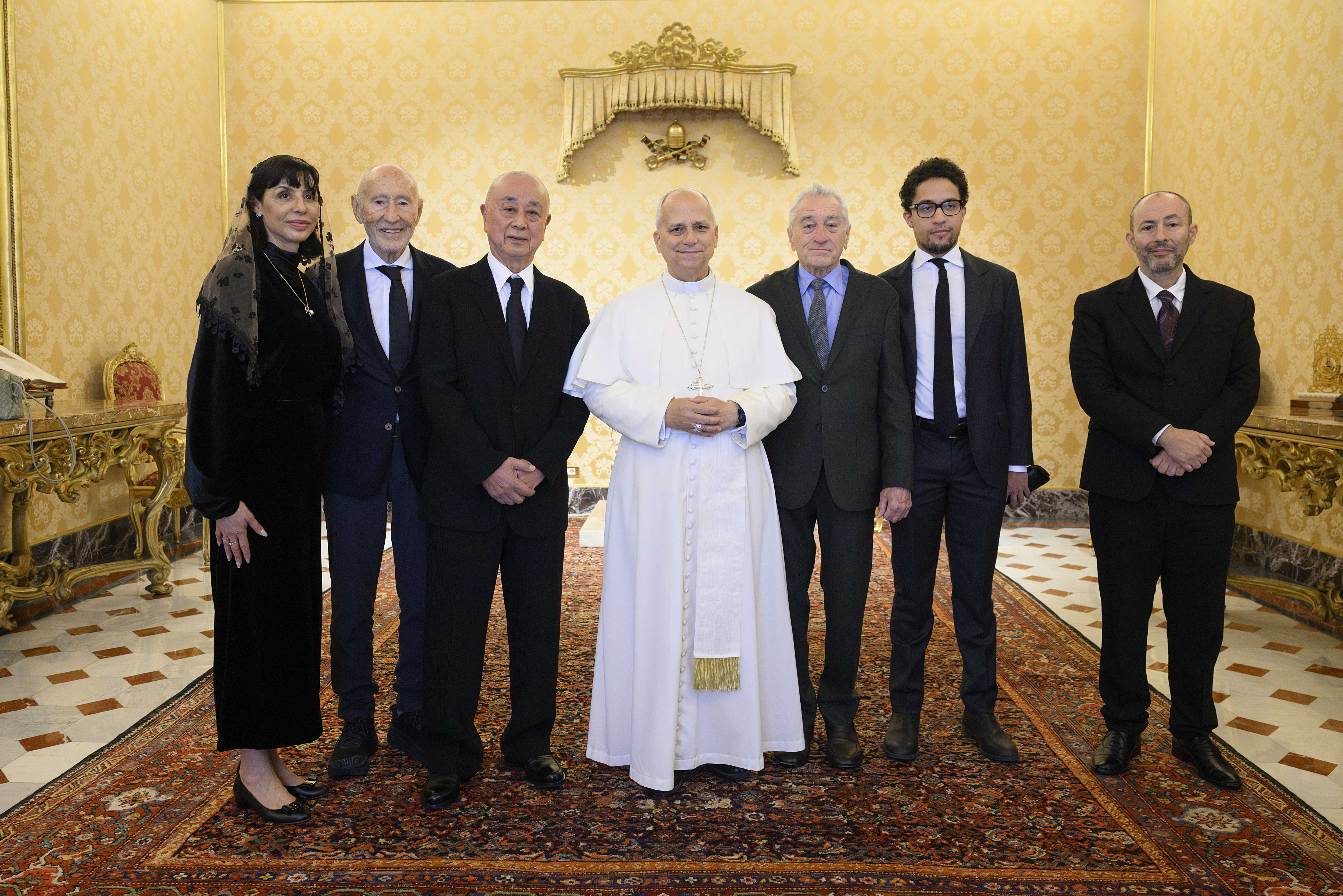Pope Leo XIV posing with Robert De Niro and others at the Apostolic Palace on November 7, 2025, in Vatican City. | Source: Getty Images