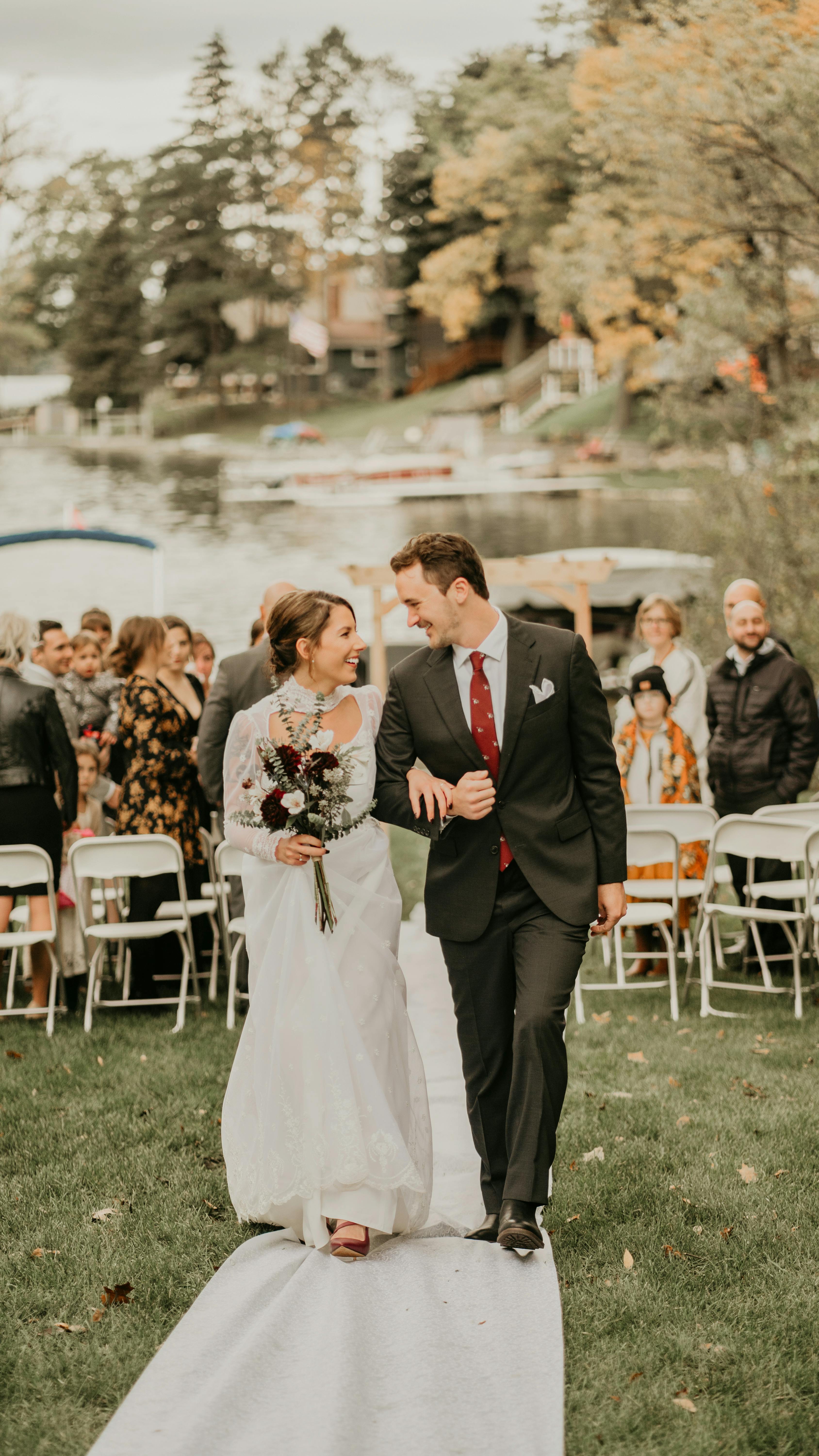 A couple walking down the aisle during their wedding ceremony | Source: Pexels