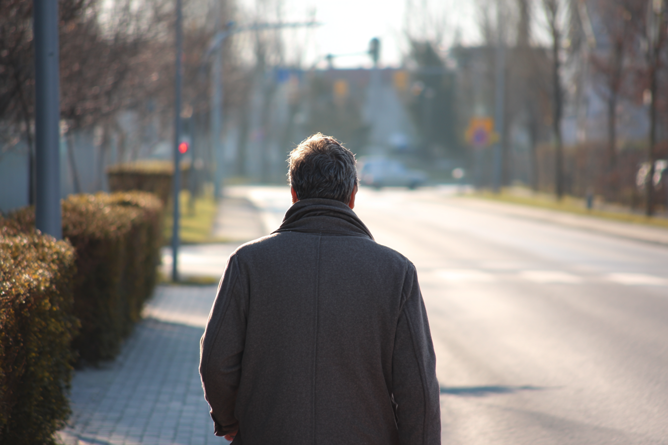 A man walking down a street | Source: Midjourney