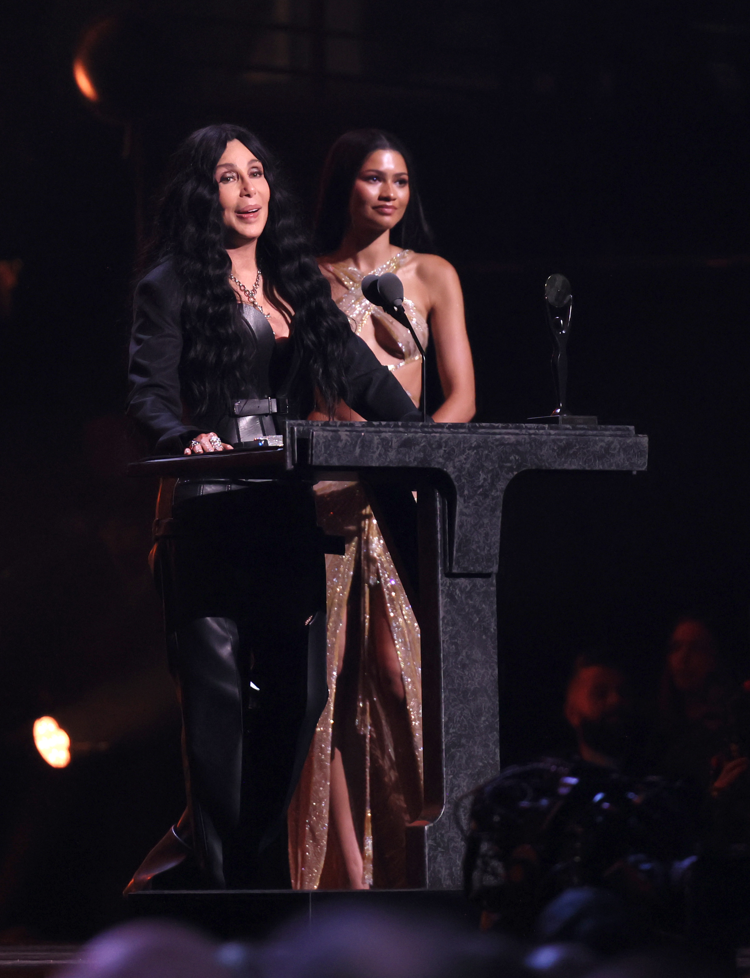 Cher and Zendaya on stage during Cher's acceptance speech at the Rock & Roll Hall of Fame Induction Ceremony in Cleveland, Ohio on October 19, 2024 | Source: Getty Images